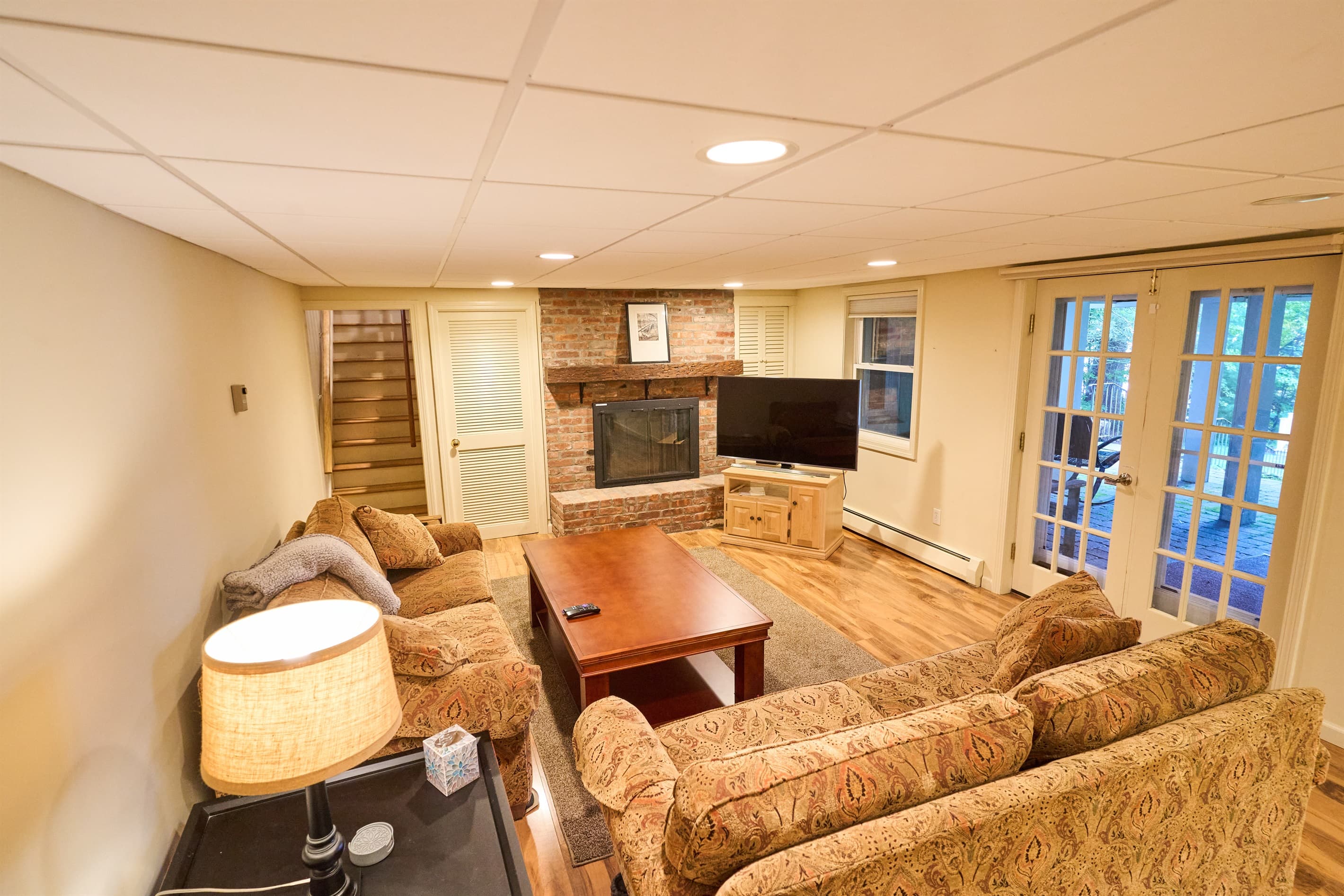 Family room on lower level. The French doors open out onto the lower level patio. 