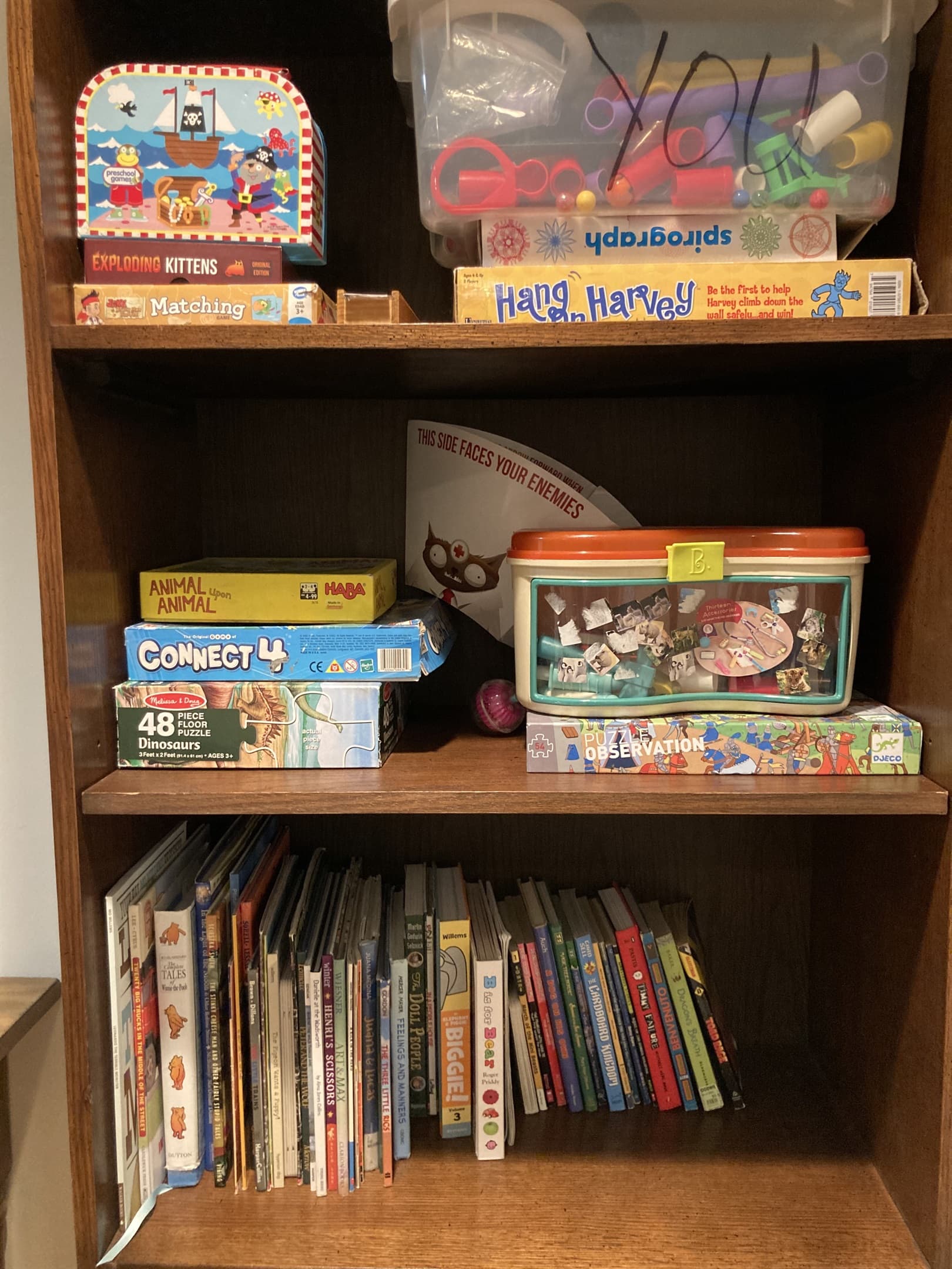 Games, toys, and books in lower level bedroom. Games and toys may vary as I replace broken items and add new ones.