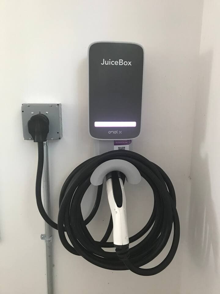 EV level 2 charger for your use. Installed in game building, but the cord can reach out under the door to the parking spots.