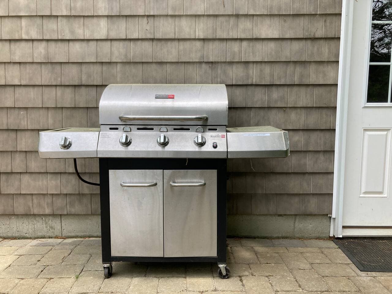 Grill in back of garage, sometimes relocated to the lower level patio.