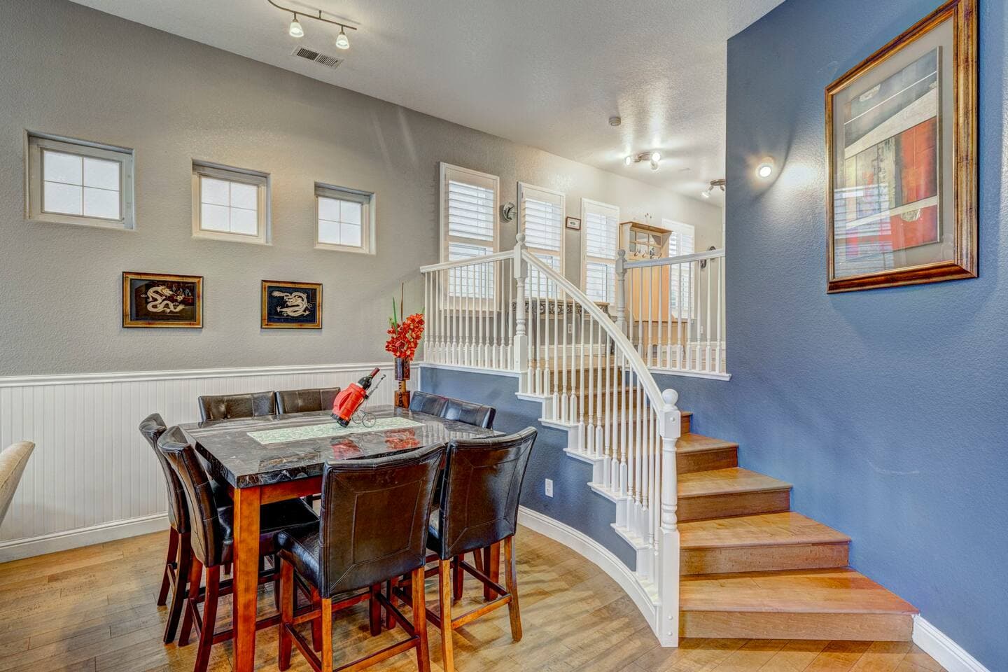 Staircase off the dining area to the top floor.