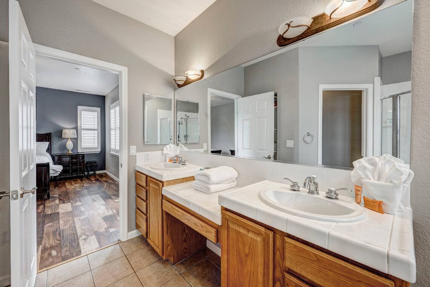 En-suite with separate vanities.