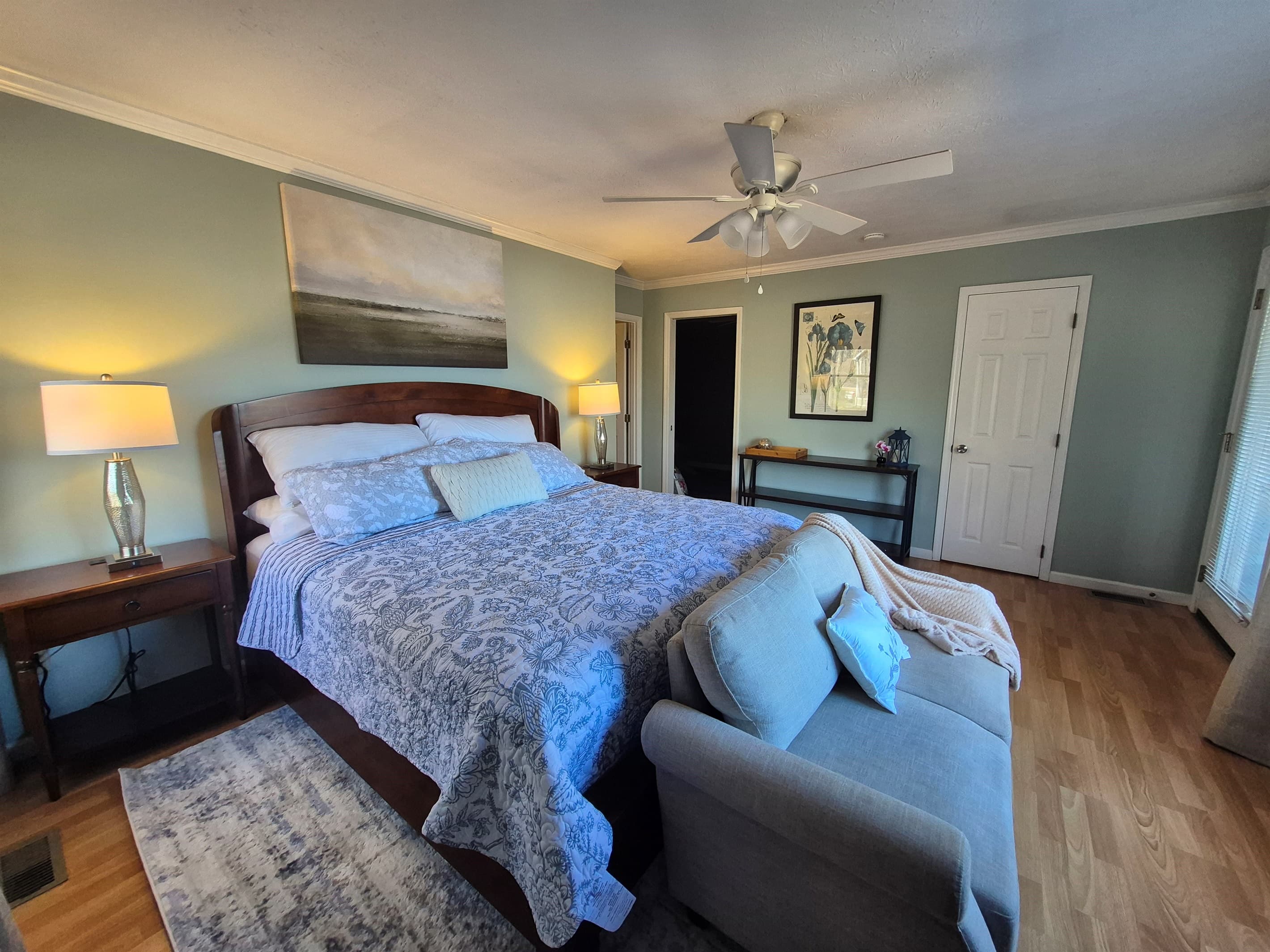 Beautifully remodeled king bedroom with seating to view lake and sunsets. 