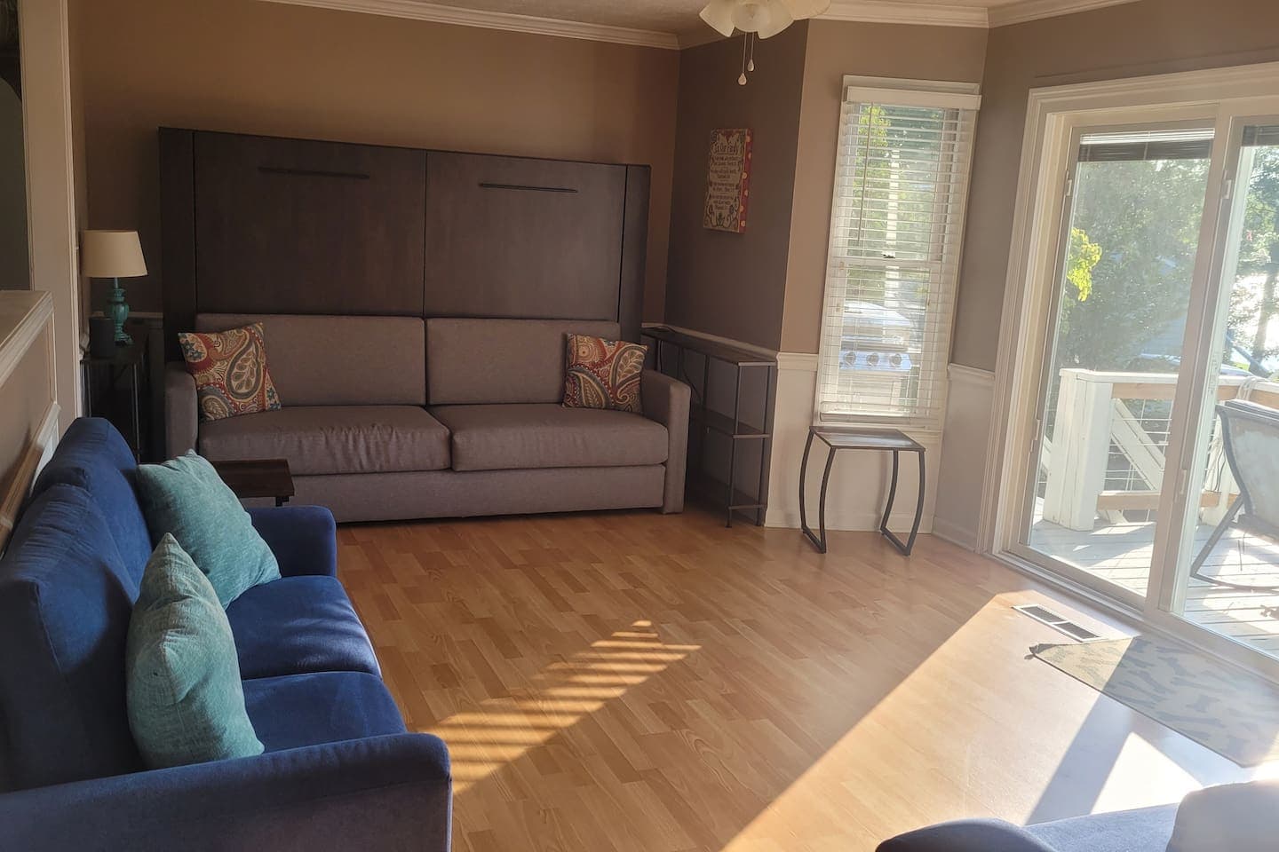 Family room open to kitchen with view of lake and pool