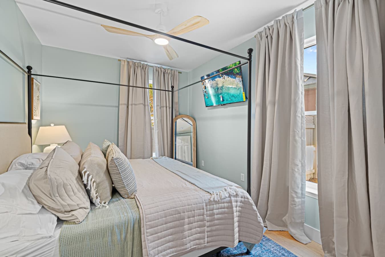 A generous sized bedroom with a large smart TV