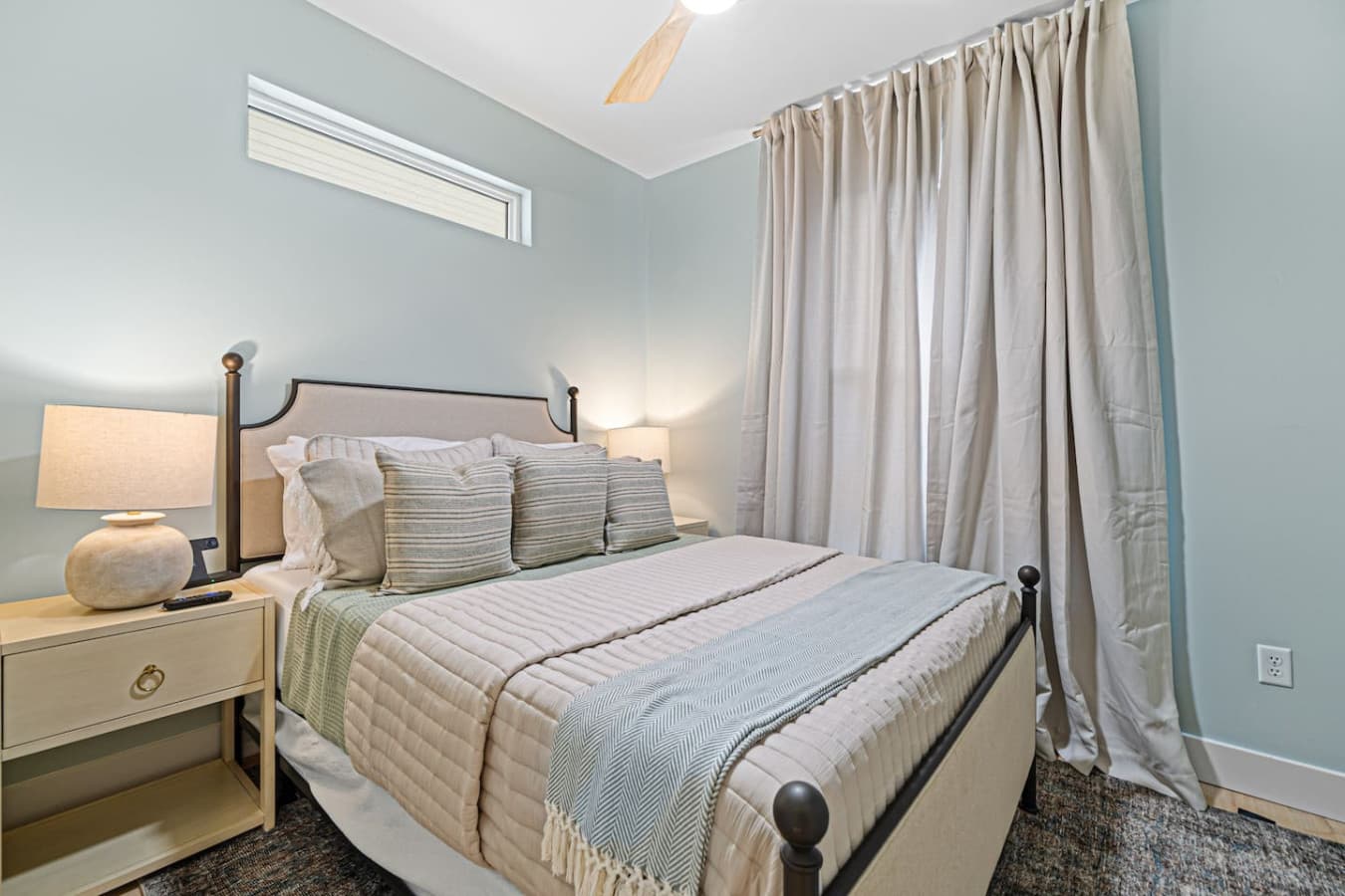 Queen bedroom with modern decor and a comfy mattress