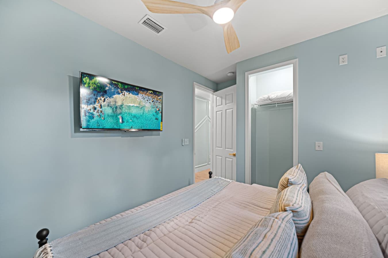 A king bedroom complete with a smart TV and a closet