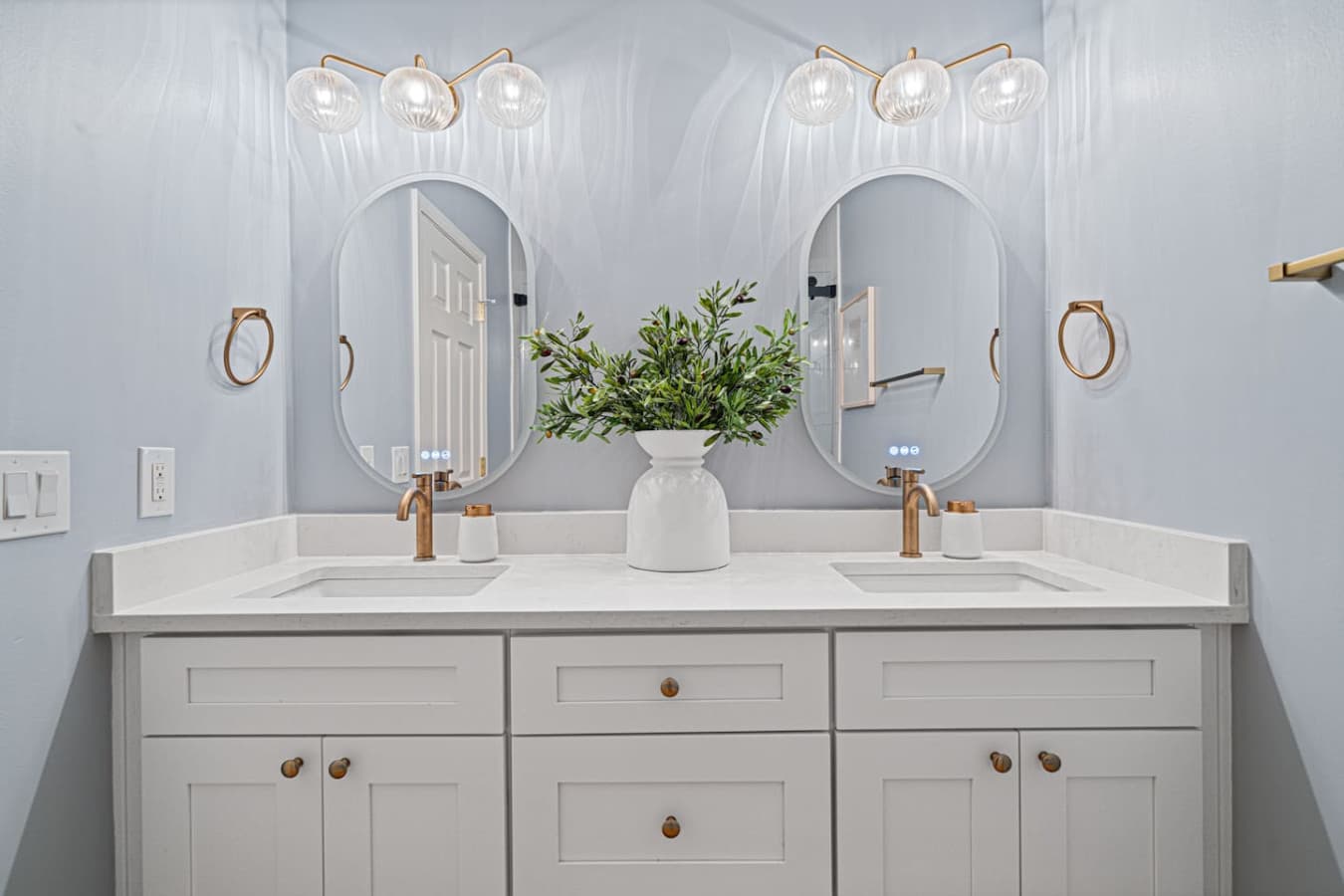 Double vanities in this full bathroom