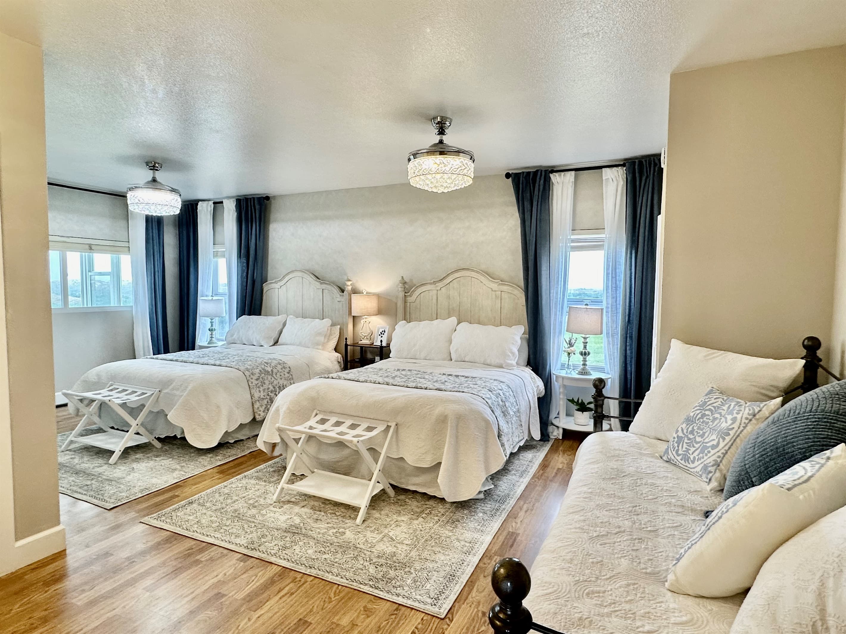 Two Queen Beds and a Twin Daybed with Twin Trundle in this spacious and stylish Queen Suite