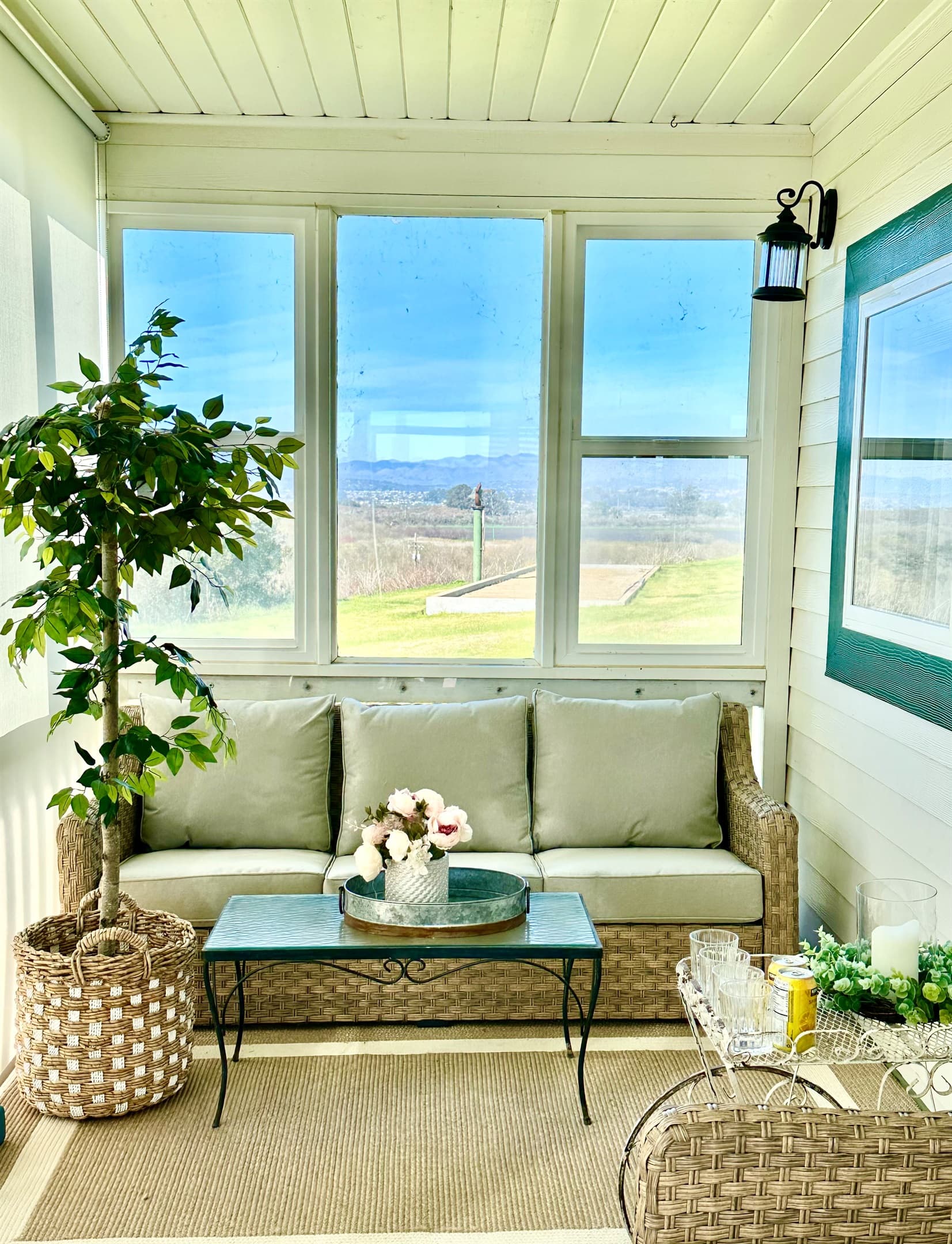 Enjoy the expansive views from this enclosed sun porch where you are protected from the coastal winds.