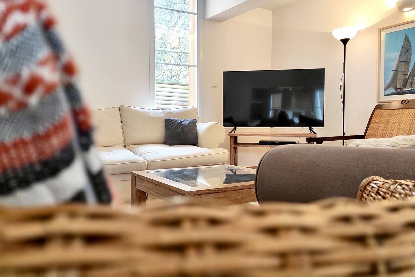 Comfortable living room with 3 sofas, TV