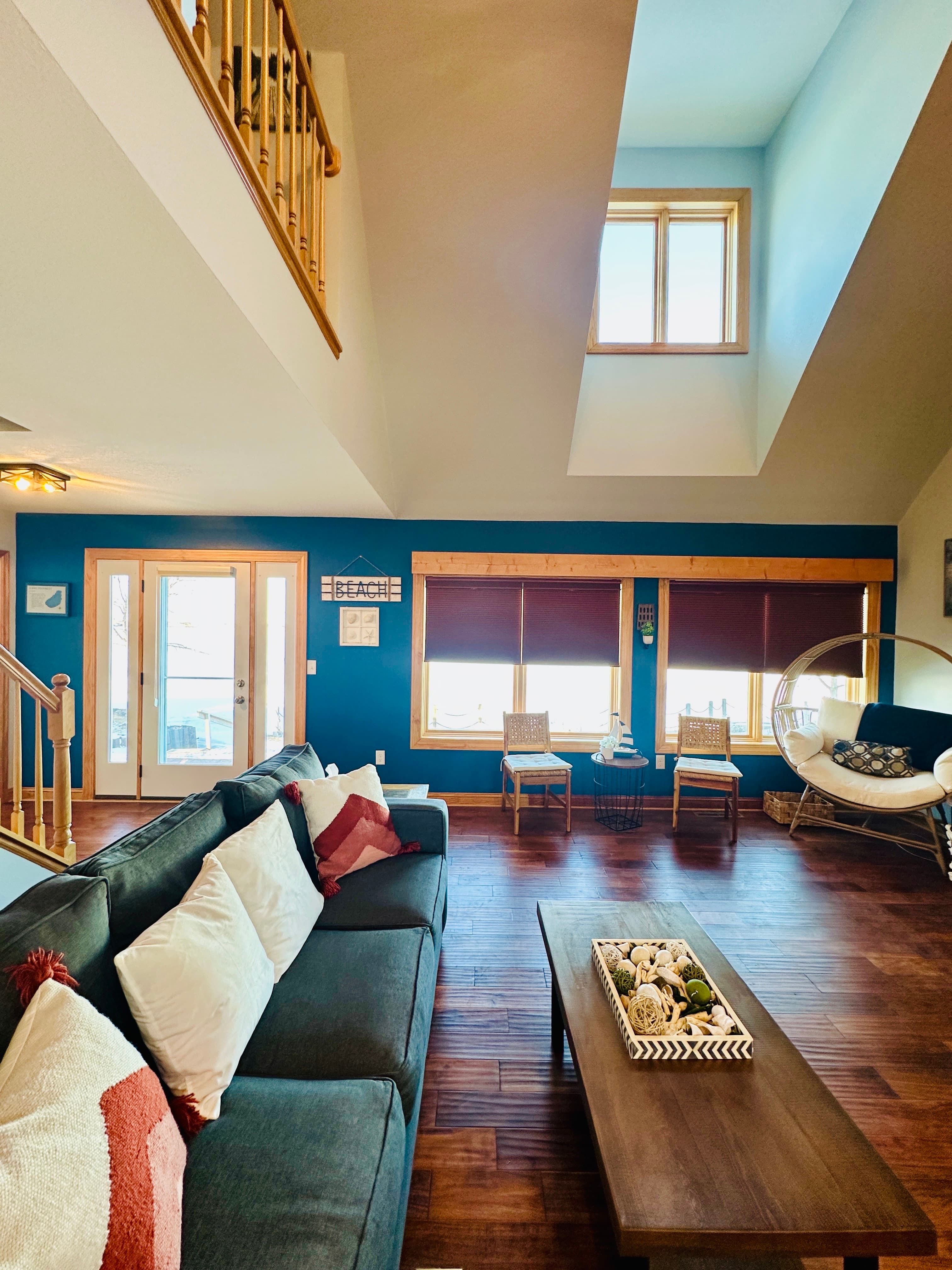 The heart of the home, offering views of the lake through large windows. 