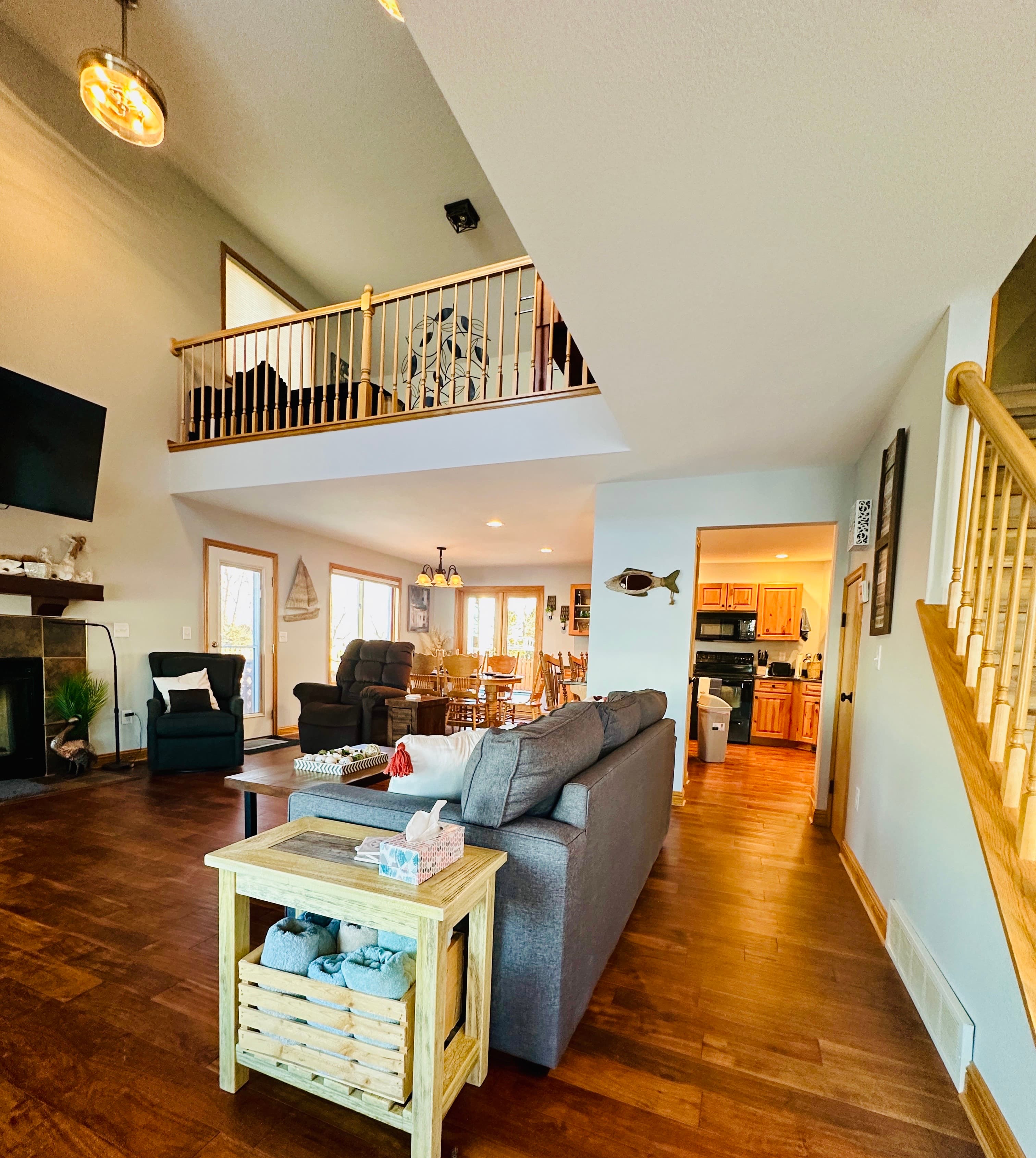 The vaulted ceilings and loft area add to the open, airy feel of the space.