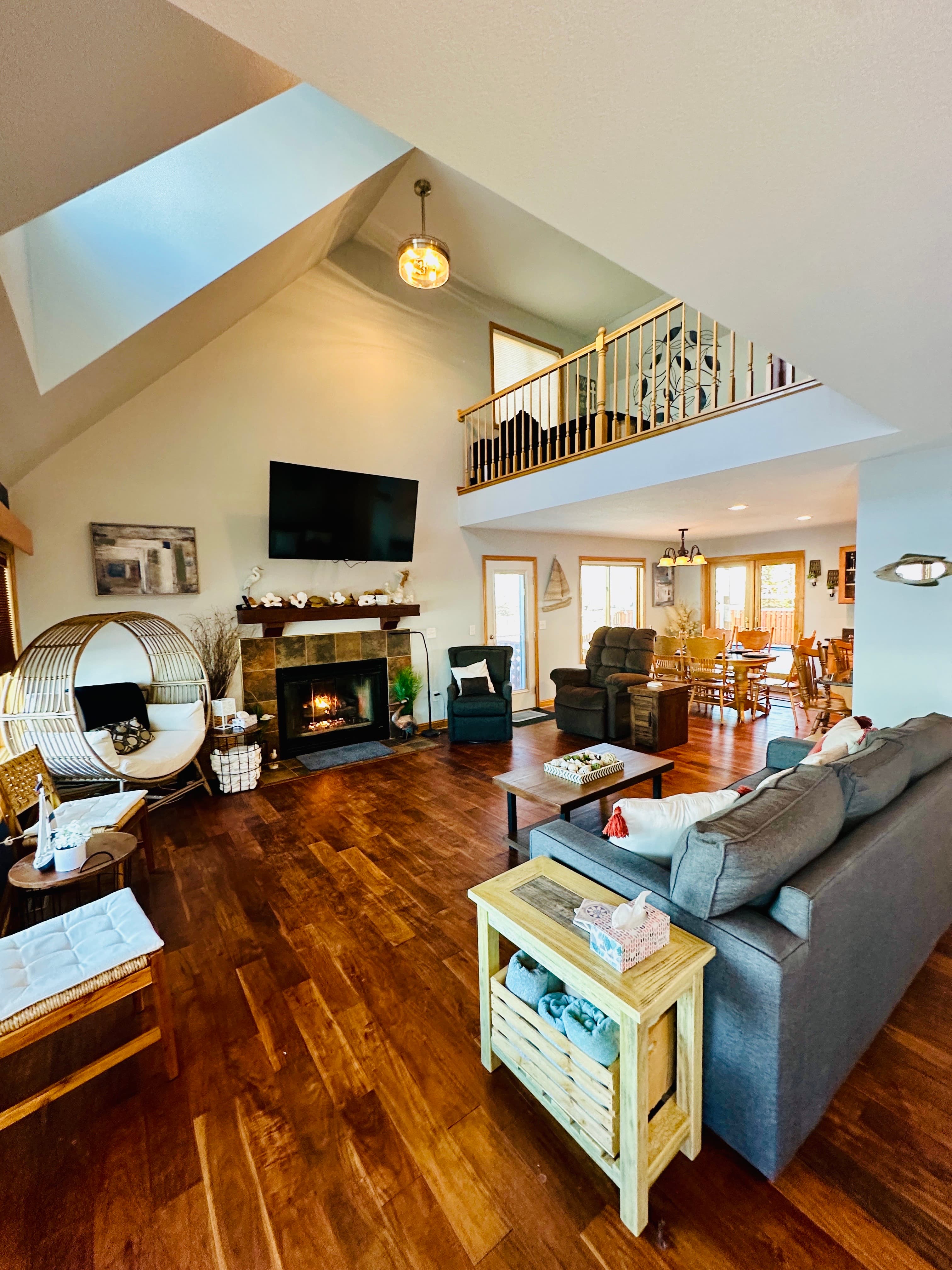 Unwind by the gas fireplace while watching TV on the new 65-inch Smart TV. 