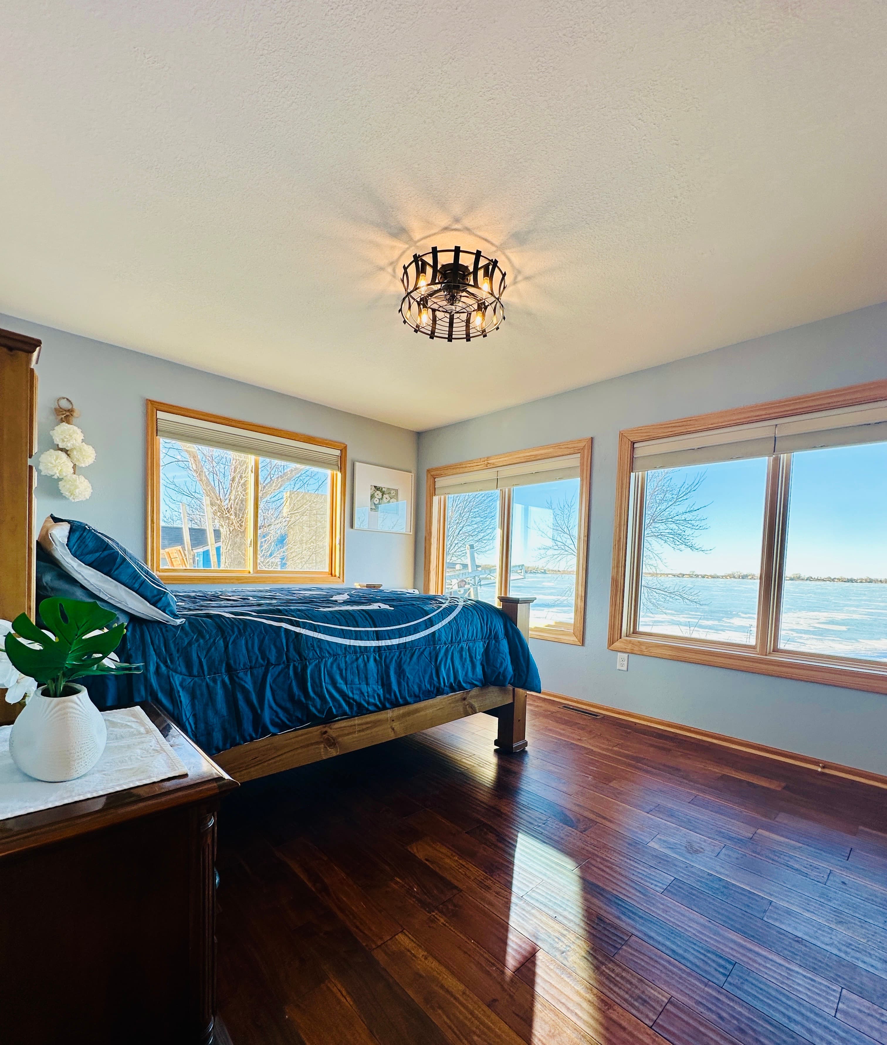 Lakeside, first-floor bedroom with a queen-size bed and breathtaking lake views. 