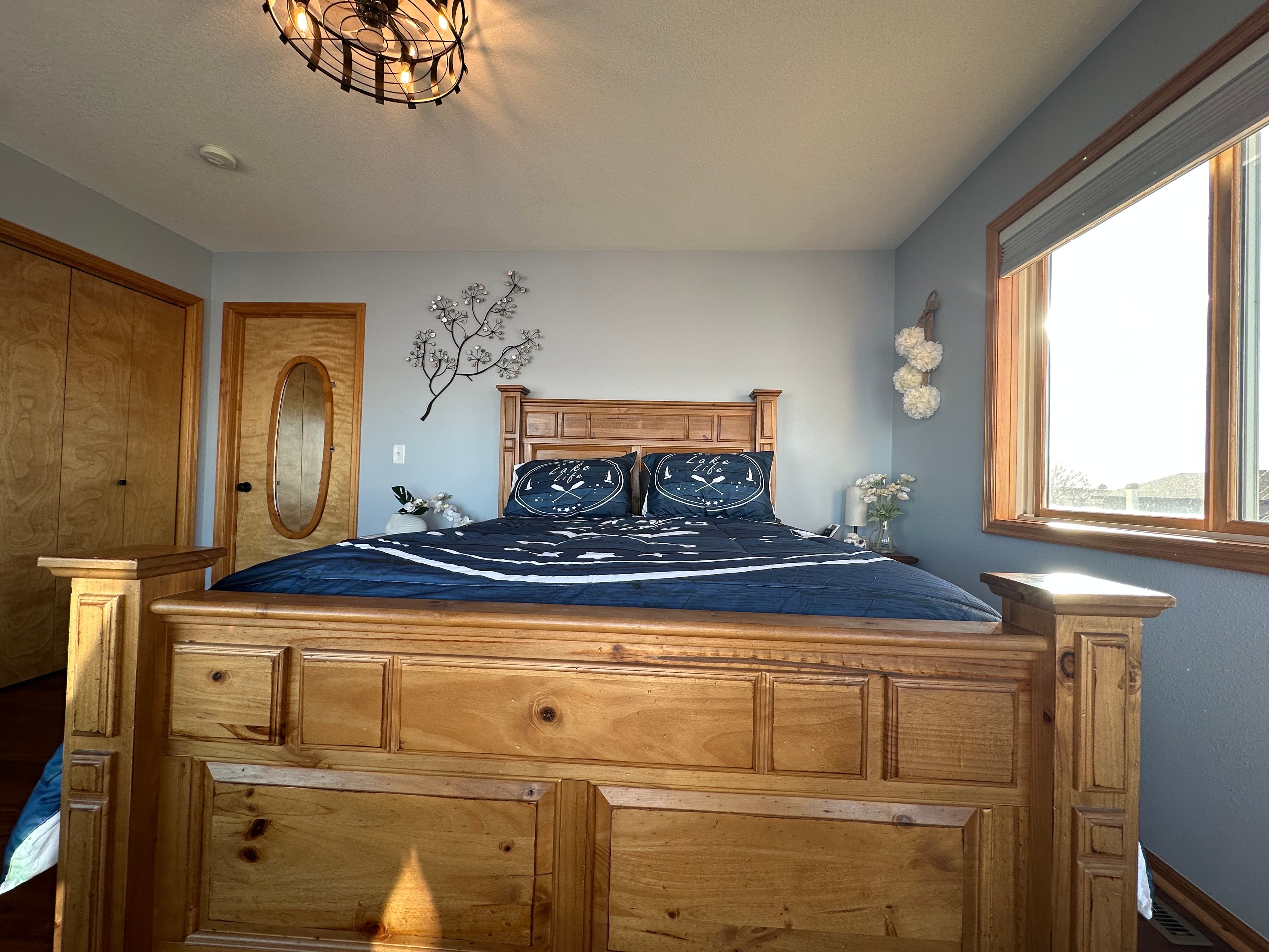 Unwind in this first-floor lakeside bedroom, complete with serene views and a flat-screen TV for laid-back evenings.