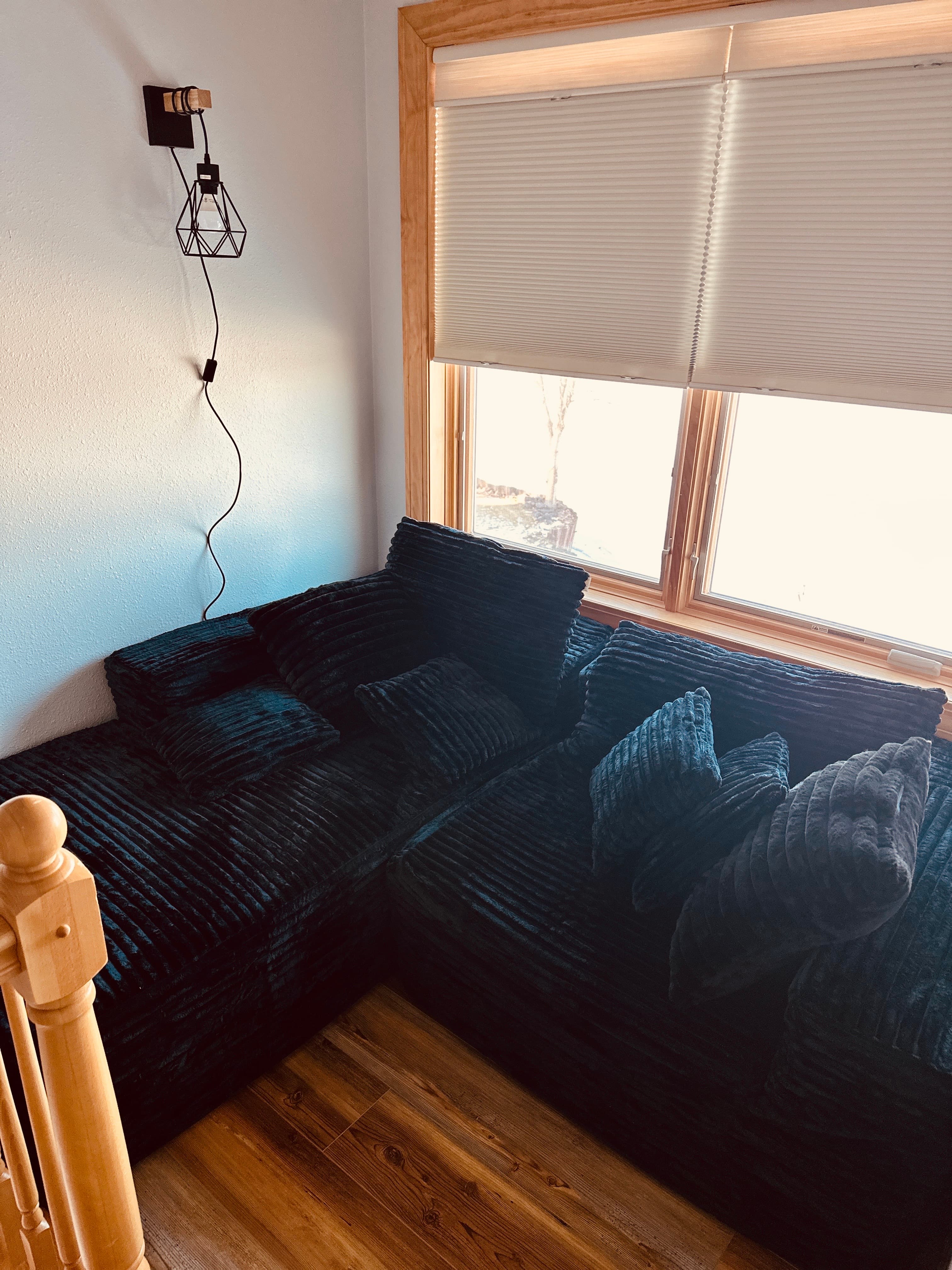 Upstairs reading nook with beautiful lake views—ideal for unwinding with your favorite book or enjoying a little quiet time.
