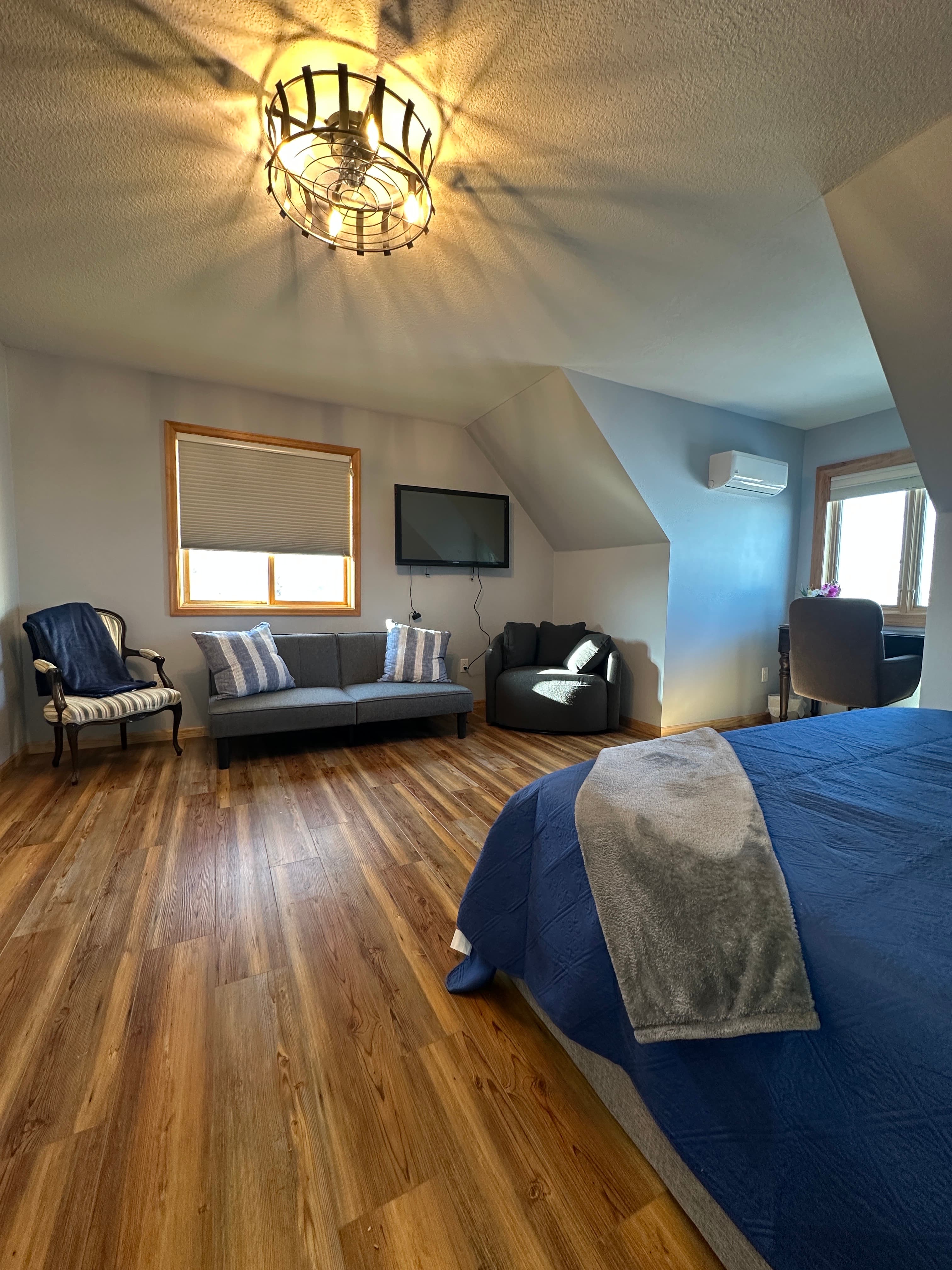 A cozy futon provides extra sleeping or lounging space in upstairs bedroom 1.