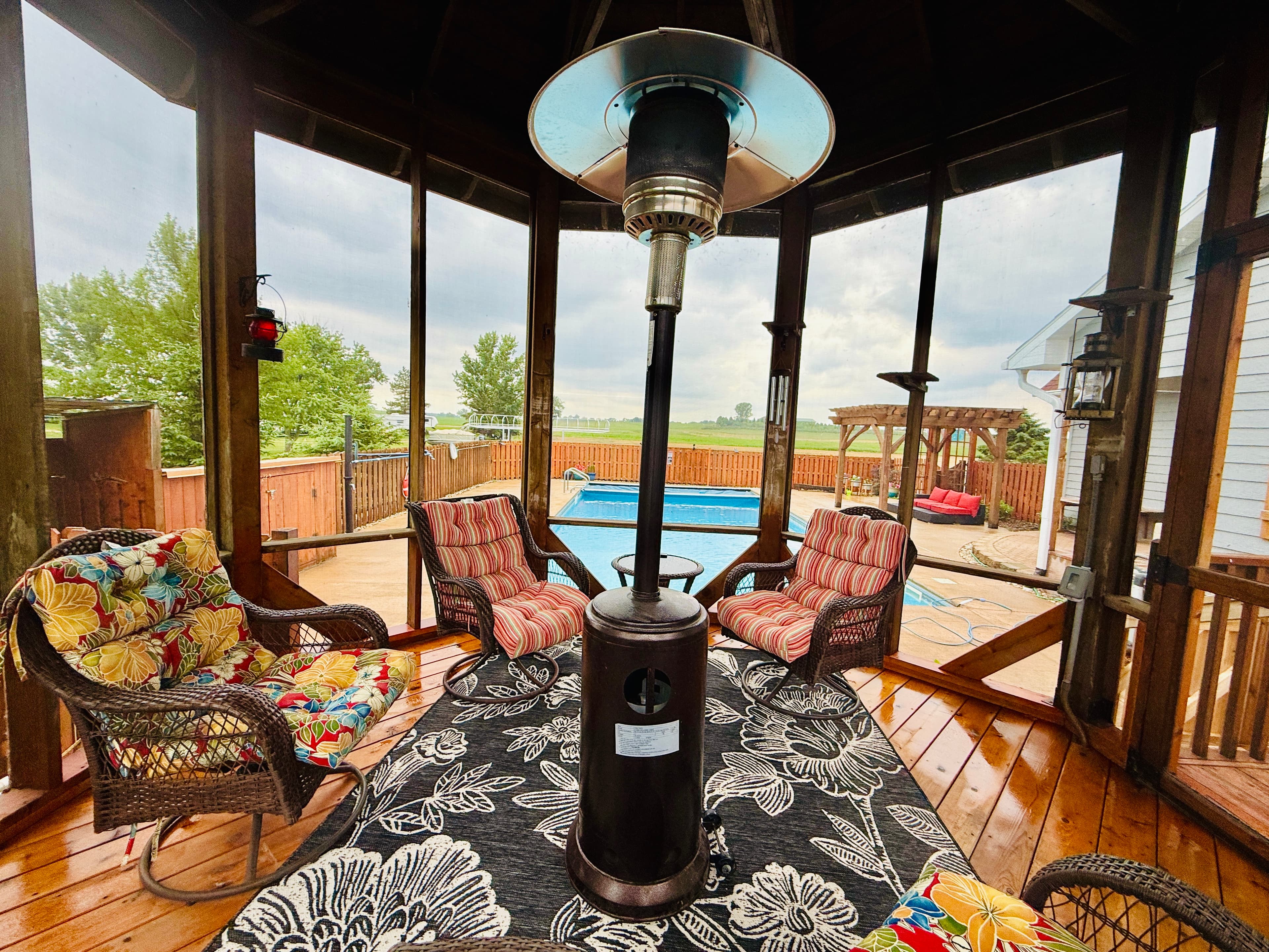 From the comfort of the screened gazebo, enjoy a peaceful view of the pool surrounded by sunshine, laughter, and lake air. It’s the perfect place to recharge between swims.