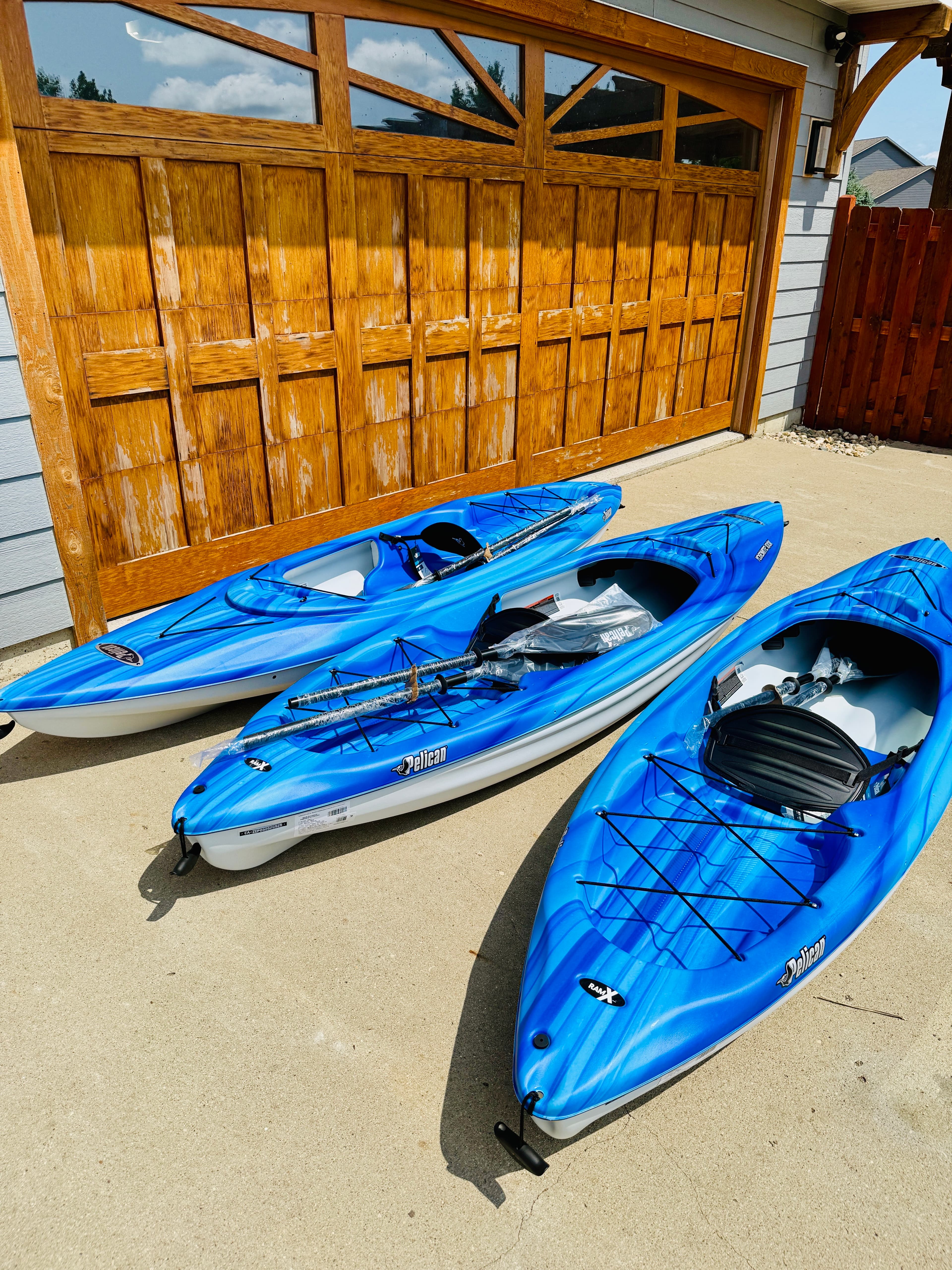 Enjoy the lake in style with three brand-new blue Pelican kayaks, each equipped with paddles—perfect for exploring right from your backyard.