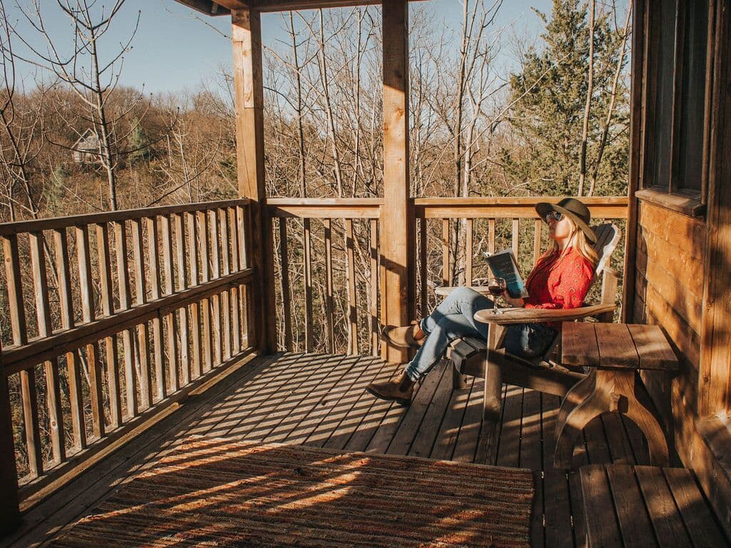 reading on guest cottage deck