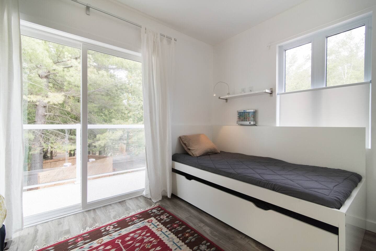 this bedroom has 4 beds in it and private veranda