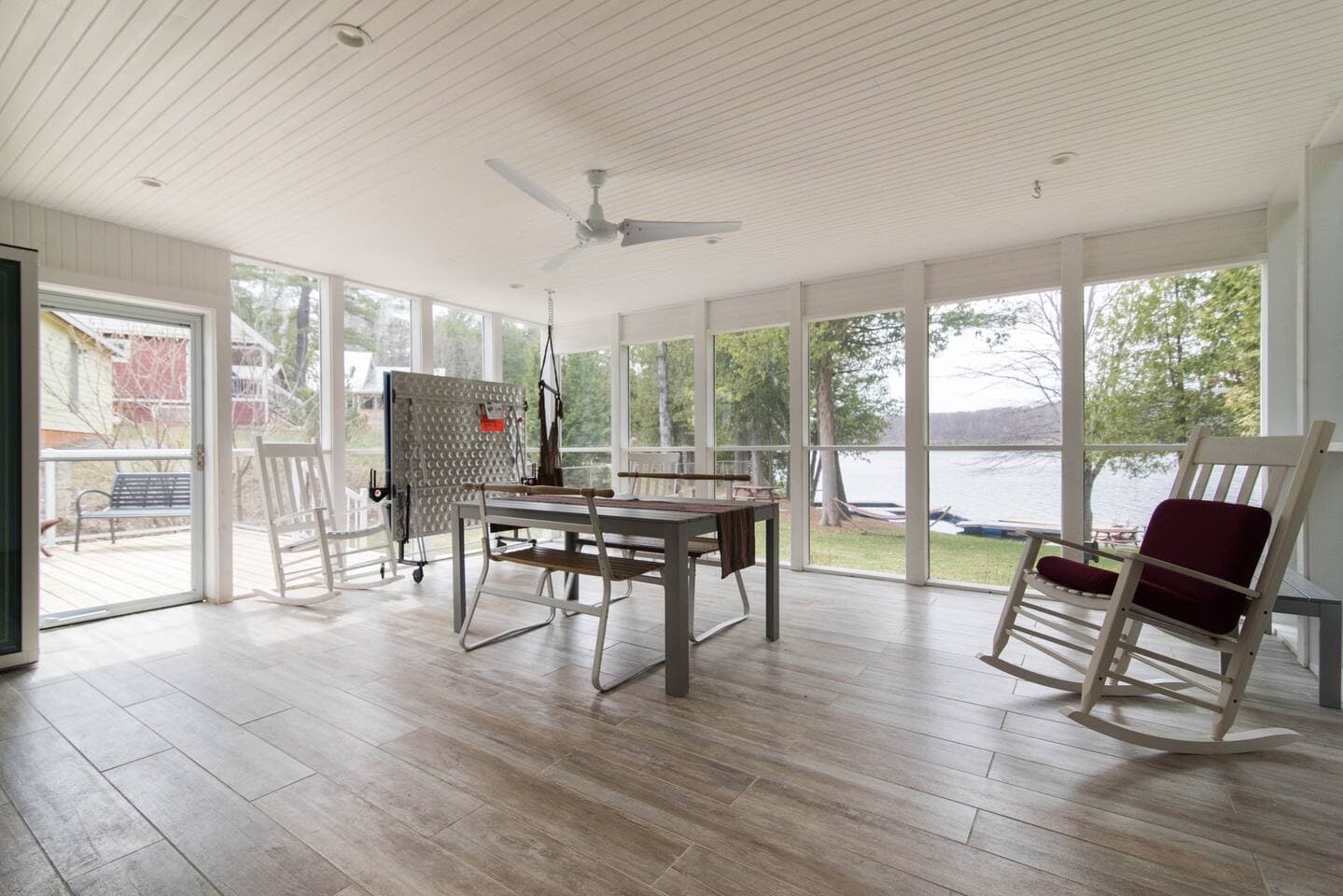 screened in porch with ping pong table