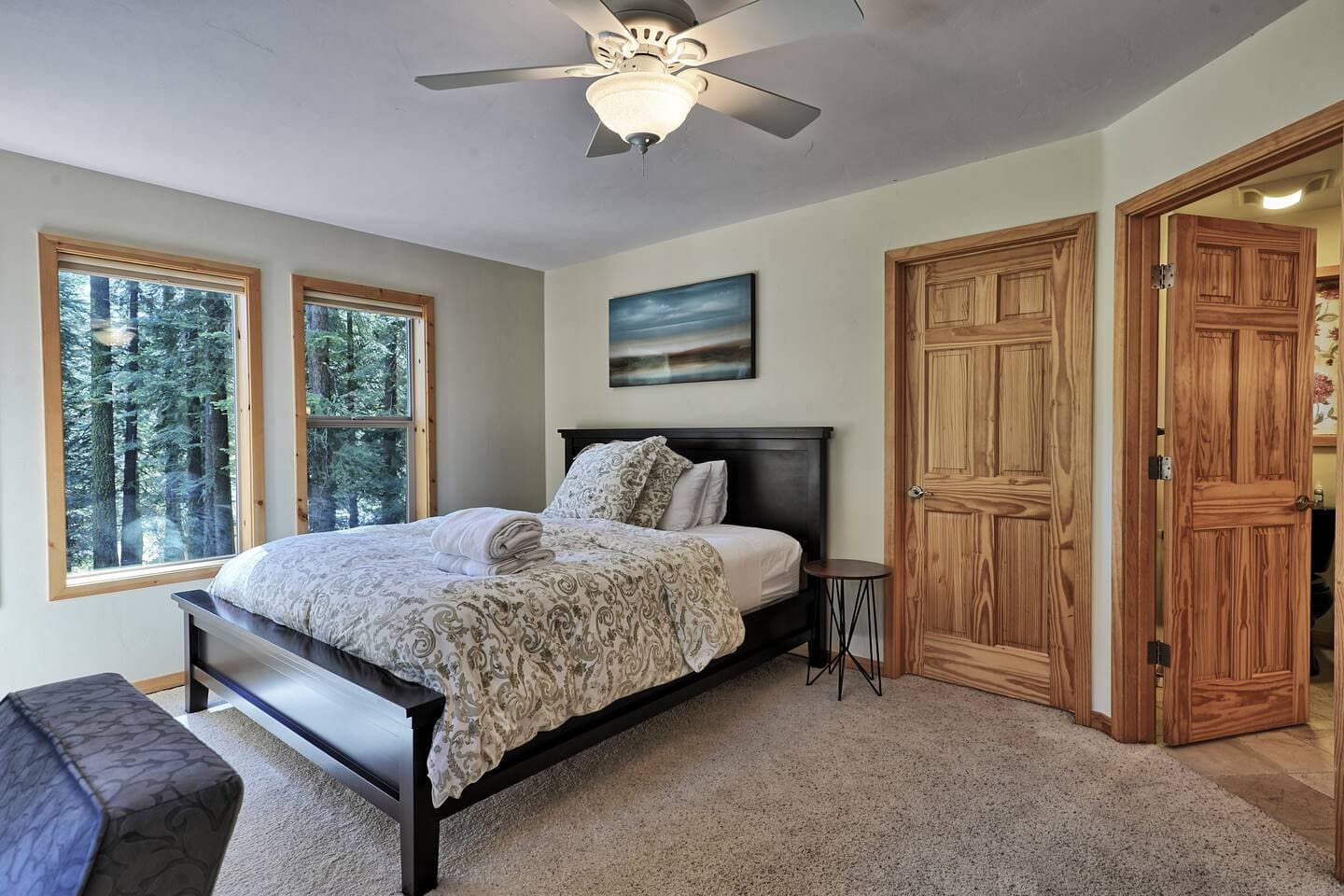 The gorgeous views make the primary bedroom a wonderful place to wake up in the morning.