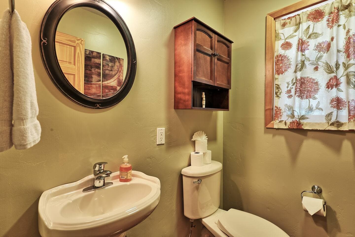 The tasteful half bathroom located upstairs