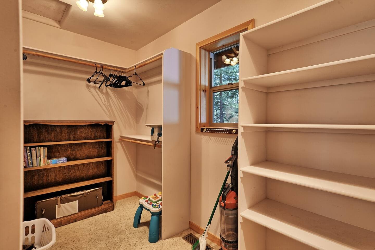 The large primary closet has plenty of storage space for your luggage.