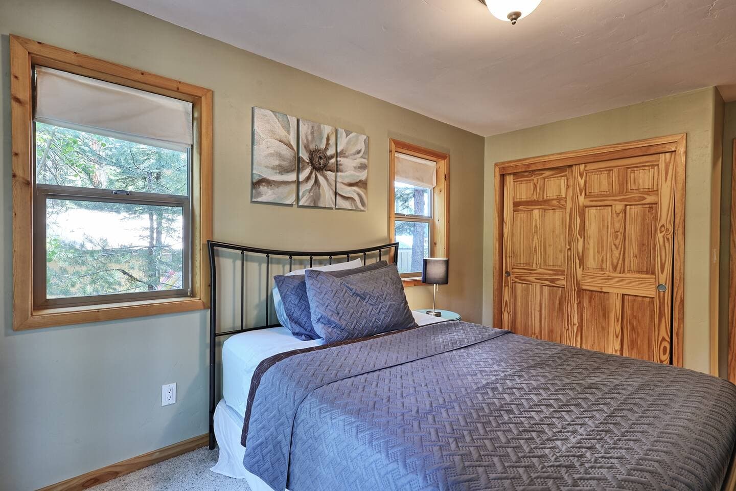 The inviting second bedroom is cozy and comfortable.