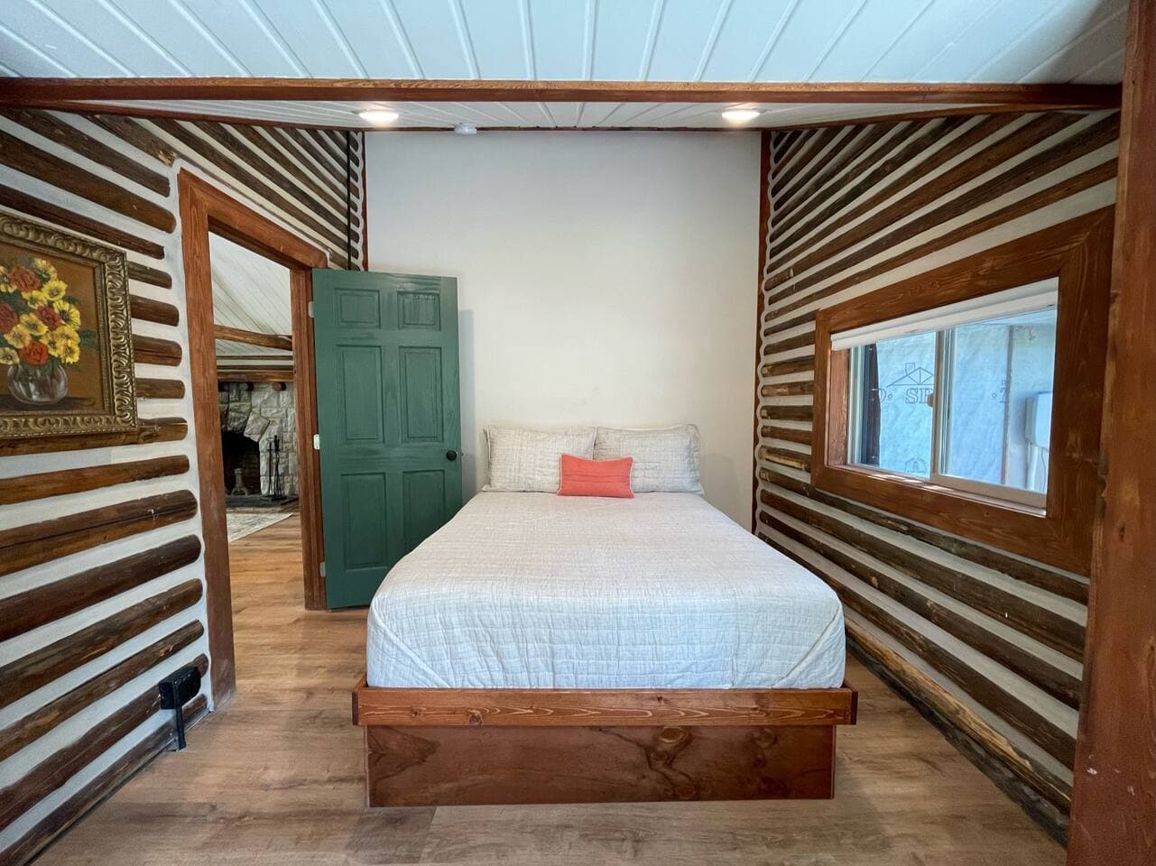 Primary bedroom with queen bed. You will love the rustic yet clean feel throughout the cabin.