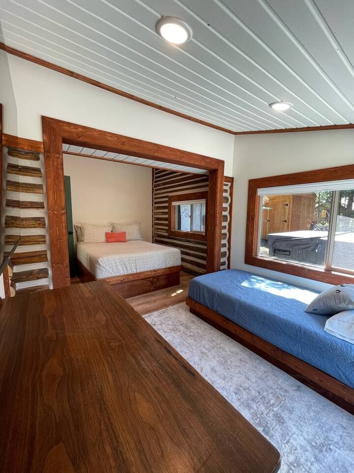 The primary bedroom is large and sleeps an additional guest on the twin bed.