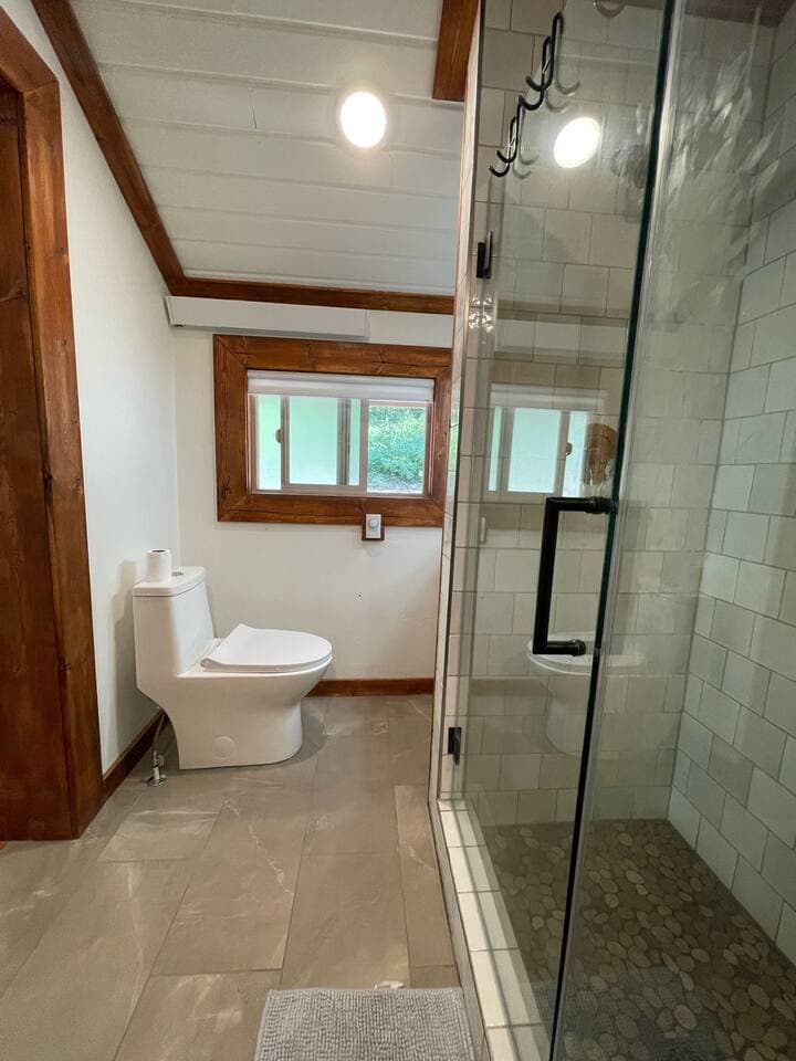 Open bathroom and large shower.