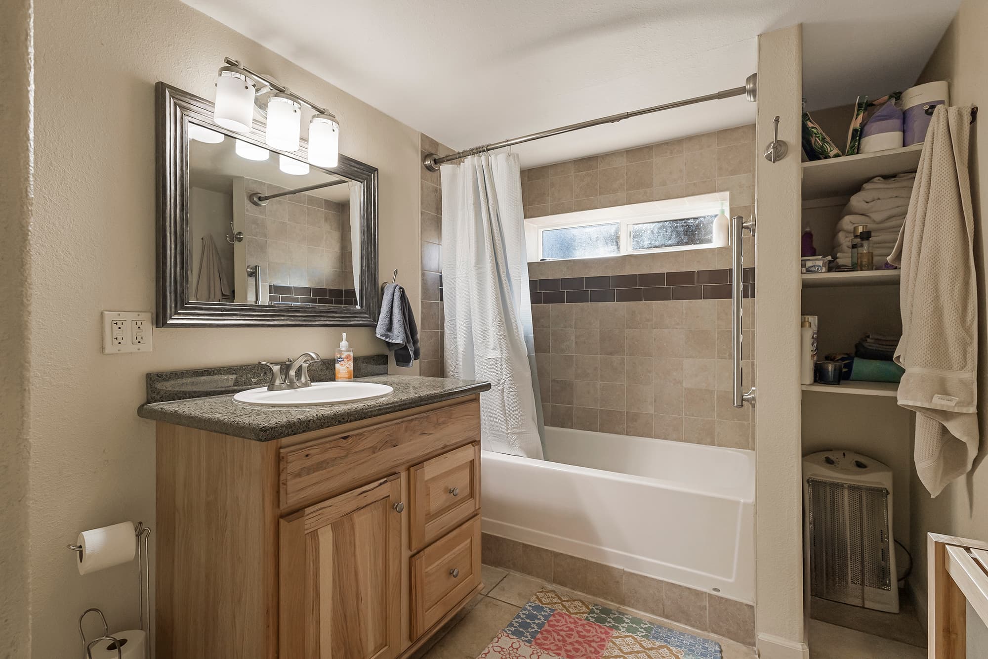 Bathroom with tub/shower combo.