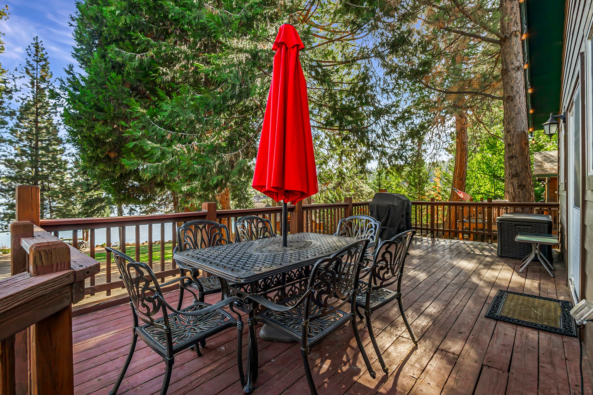 Cabin 7 balcony with seating and a BBQ.