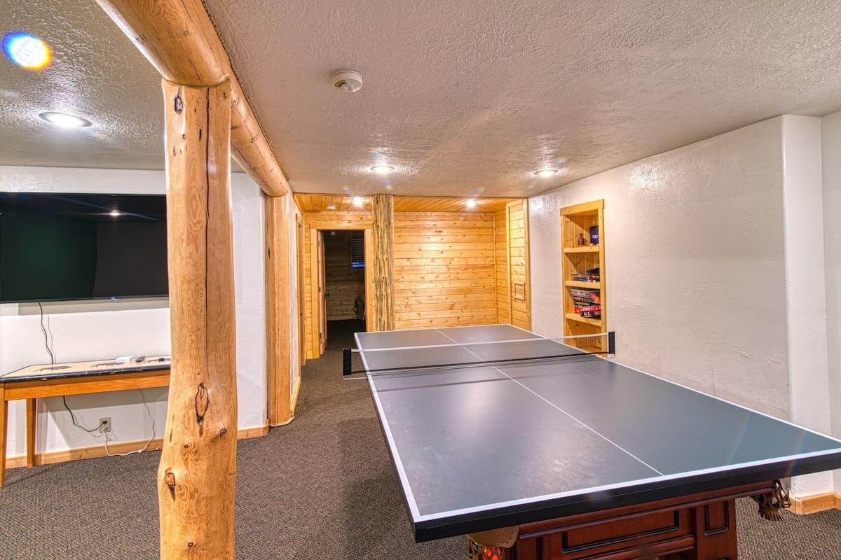 Pool table can be converted into a ping pong table.