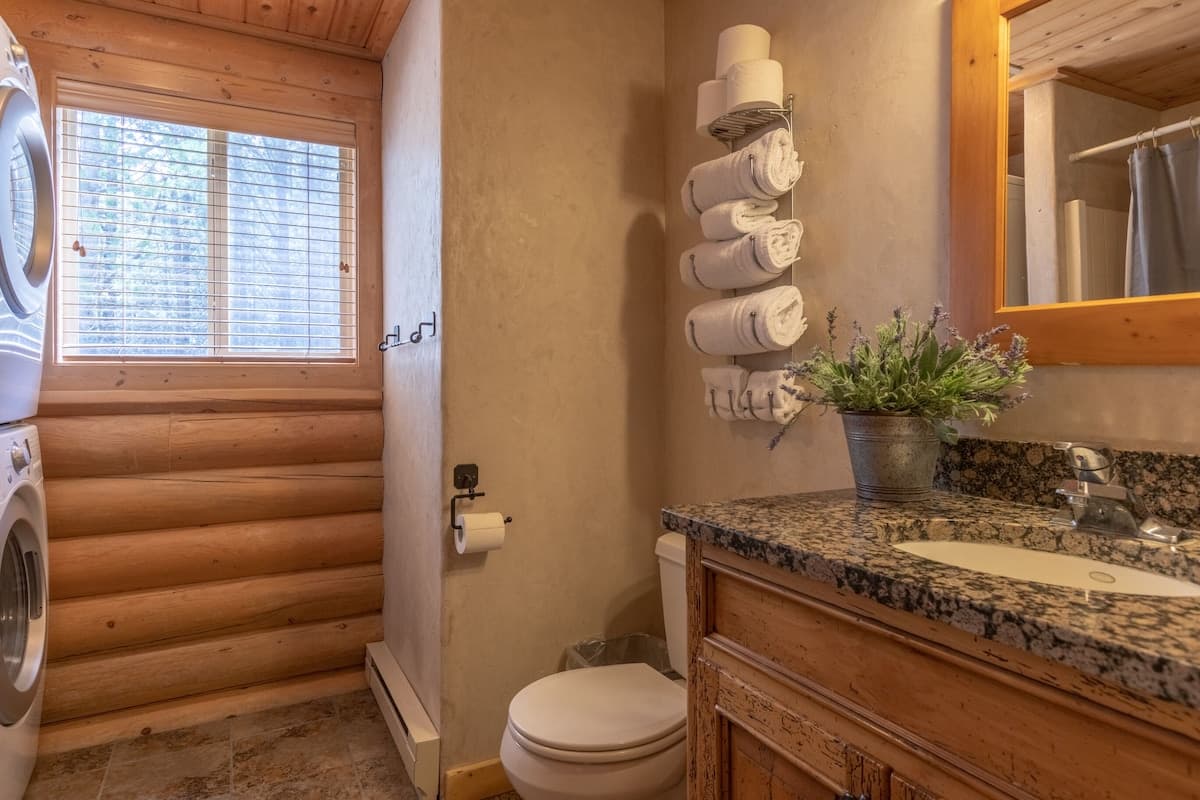 Plenty of linens, countertop space and natural light make this bathroom the perfect place to get ready in the mornings.  There is a washer and dryer for your convenience as well.