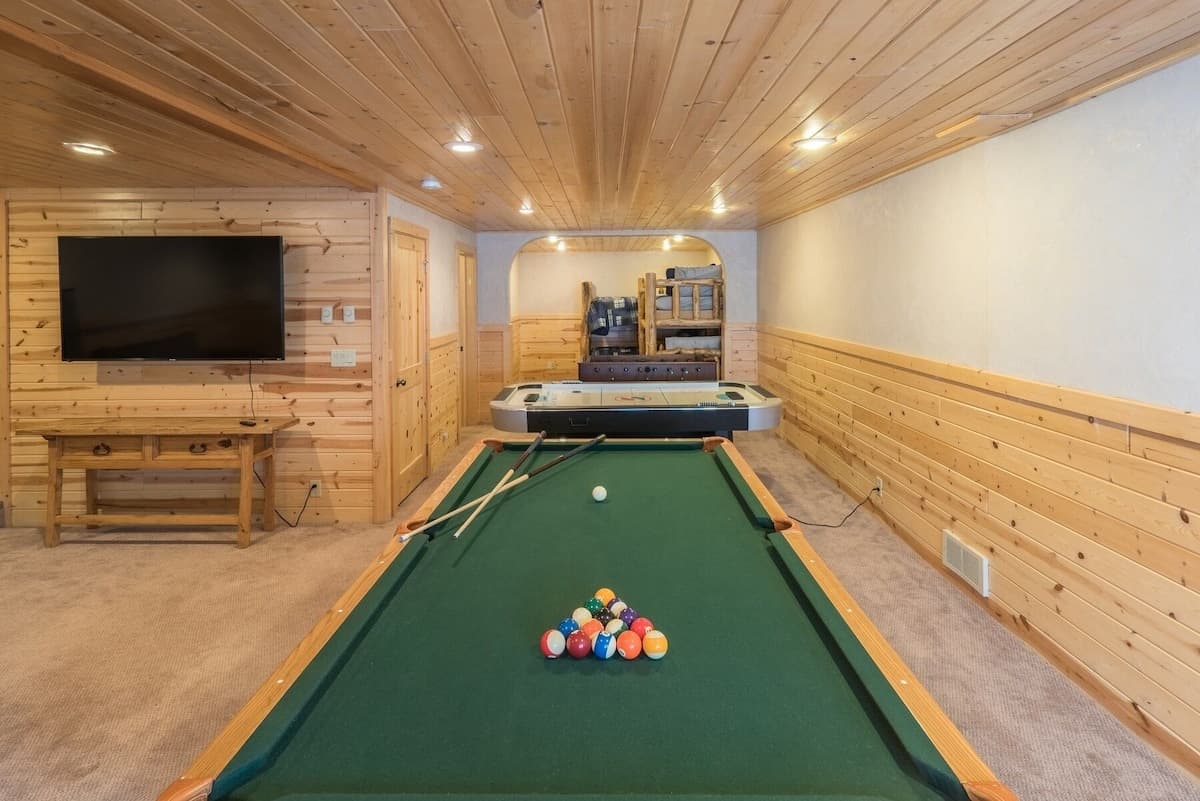 In the game room, you can watch a movie while you play a game of pool.