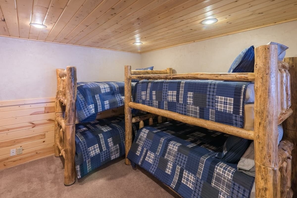 Two sets of bunk beds make for a perfect room for the kids.