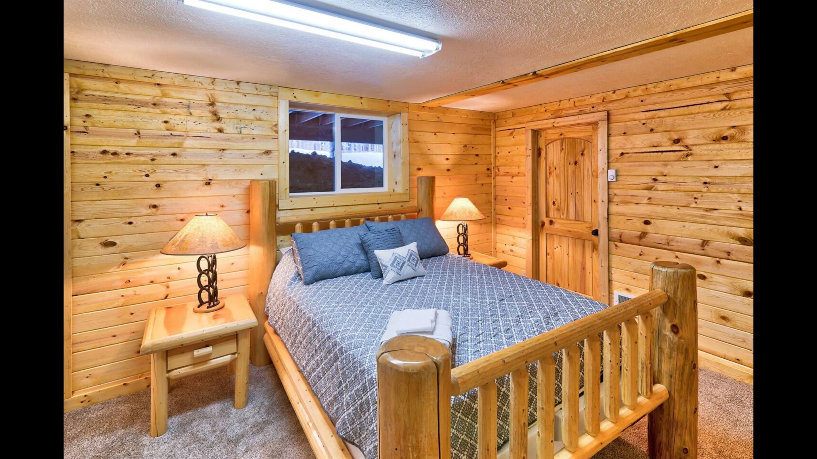 Bedroom 4: Here's a wooden bed that seamlessly blends comfort, rustic allure, and meticulous craftsmanship.