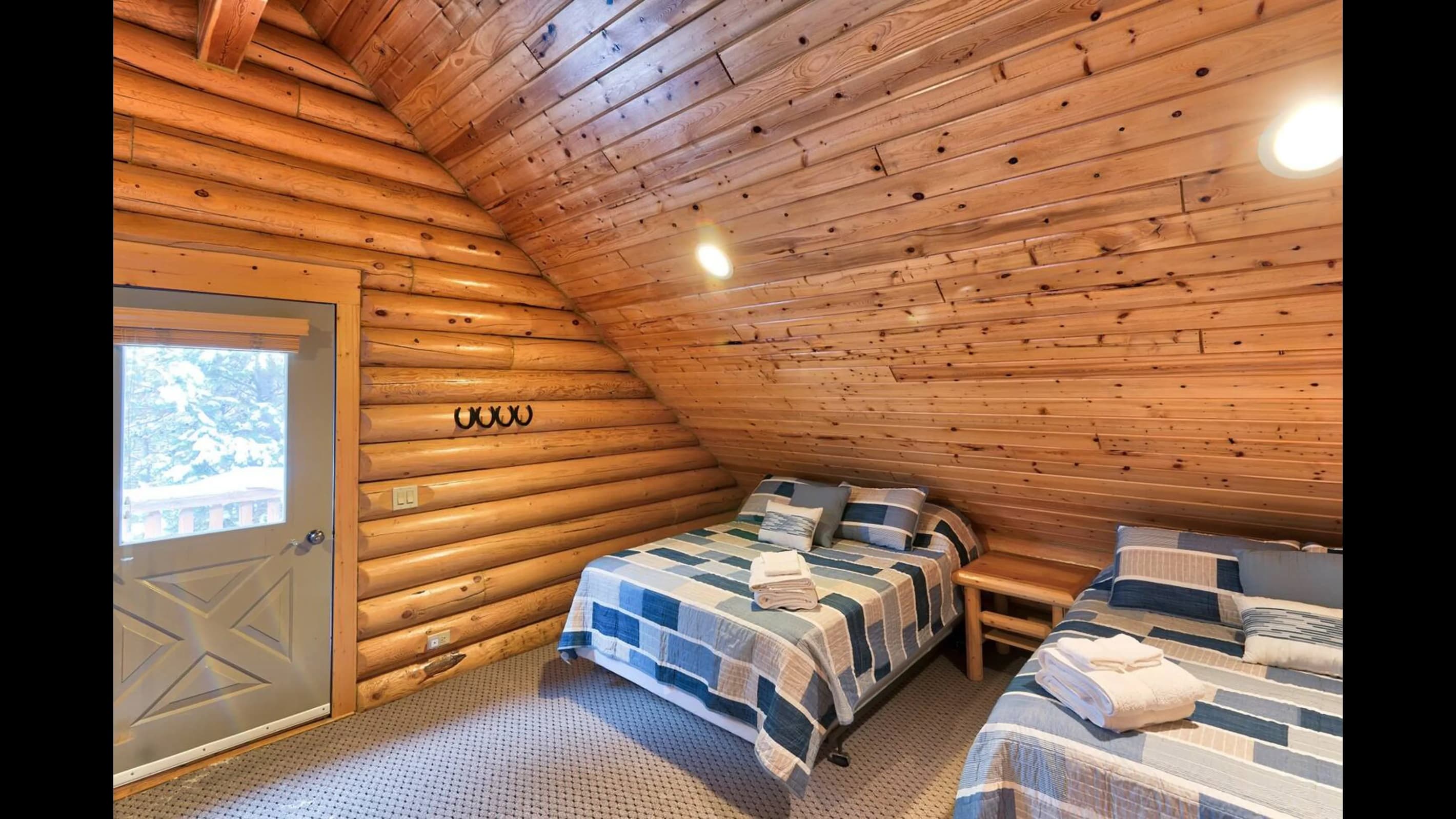 Bedroom 5: Two full-sized beds, perfect for providing a comfortable space for the kids to relax and hang out.