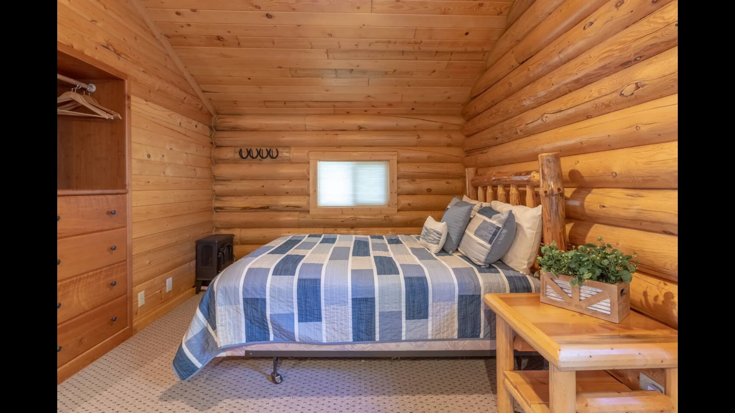 The room’s walls are also made of wood, contributing to the overall rustic feel.