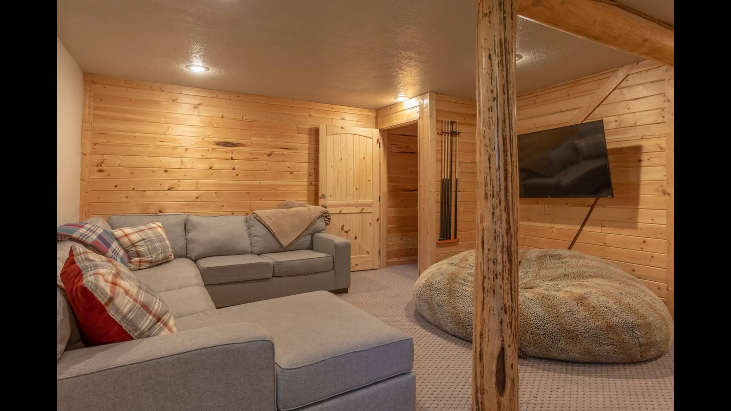 A cozy bean bag chair invites lounging or spectating, perfect for a refreshing break between games.