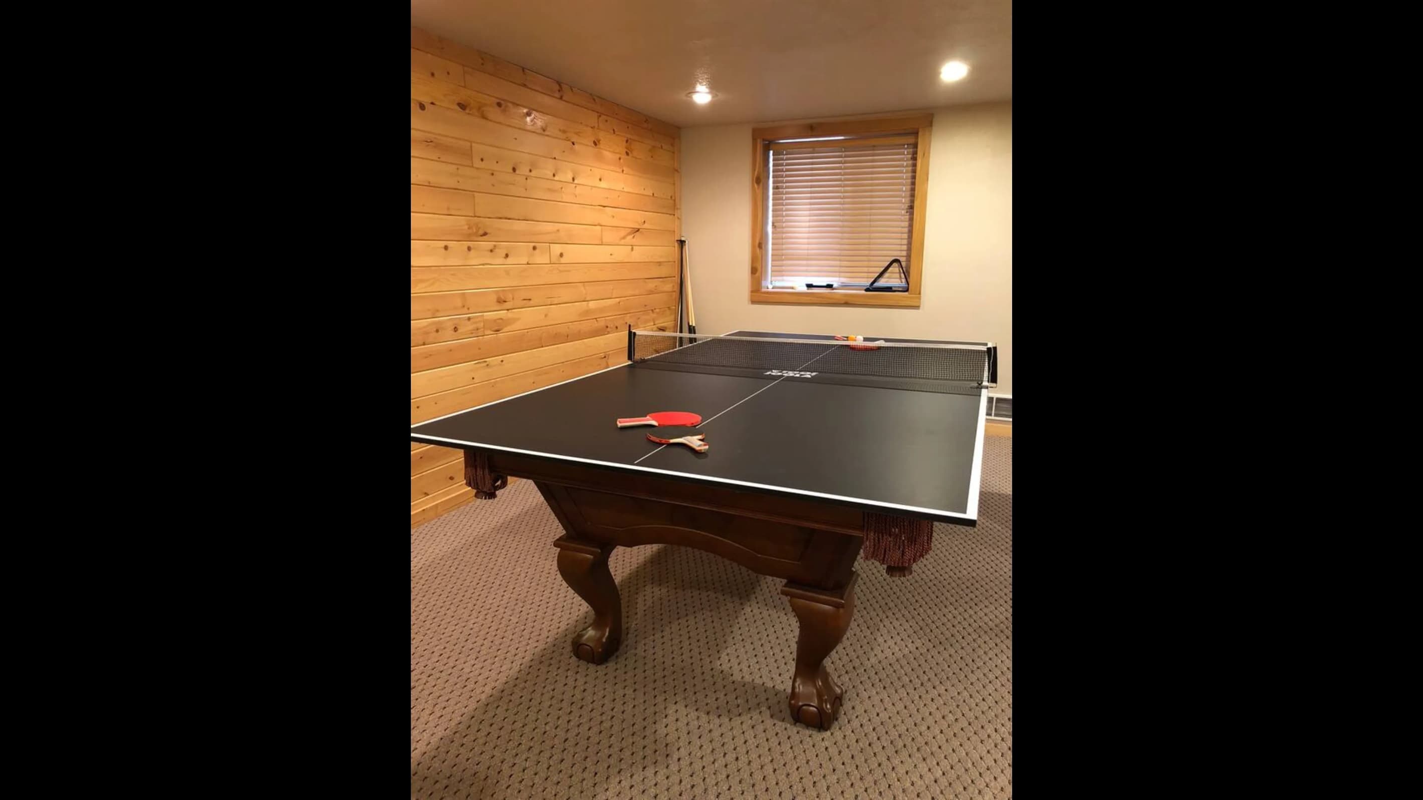 The Billiards table can change into a ping pong table for an extra game to play.
