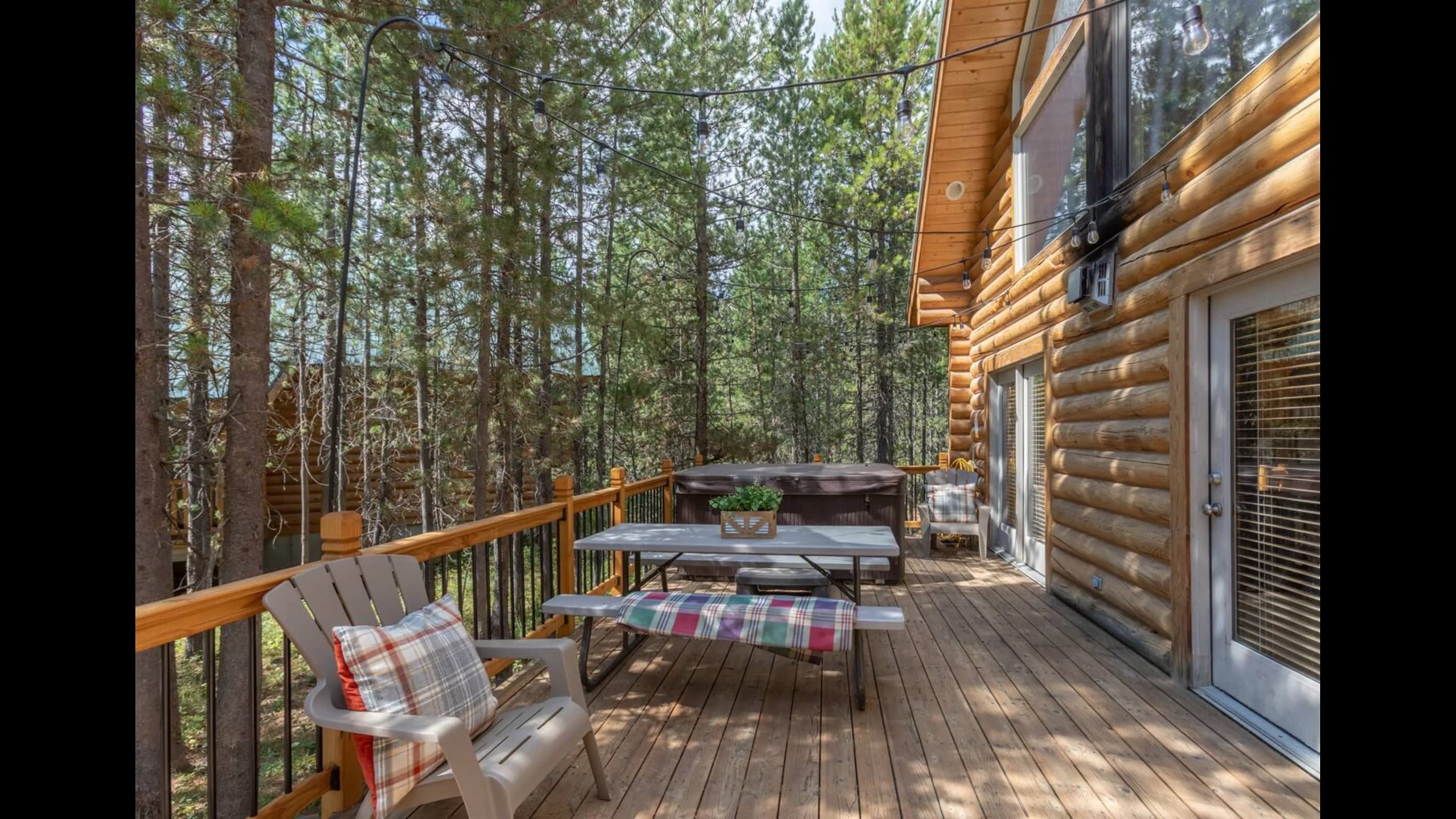 Experience the serenity of nature on the wooden deck enveloped by lush forest.
