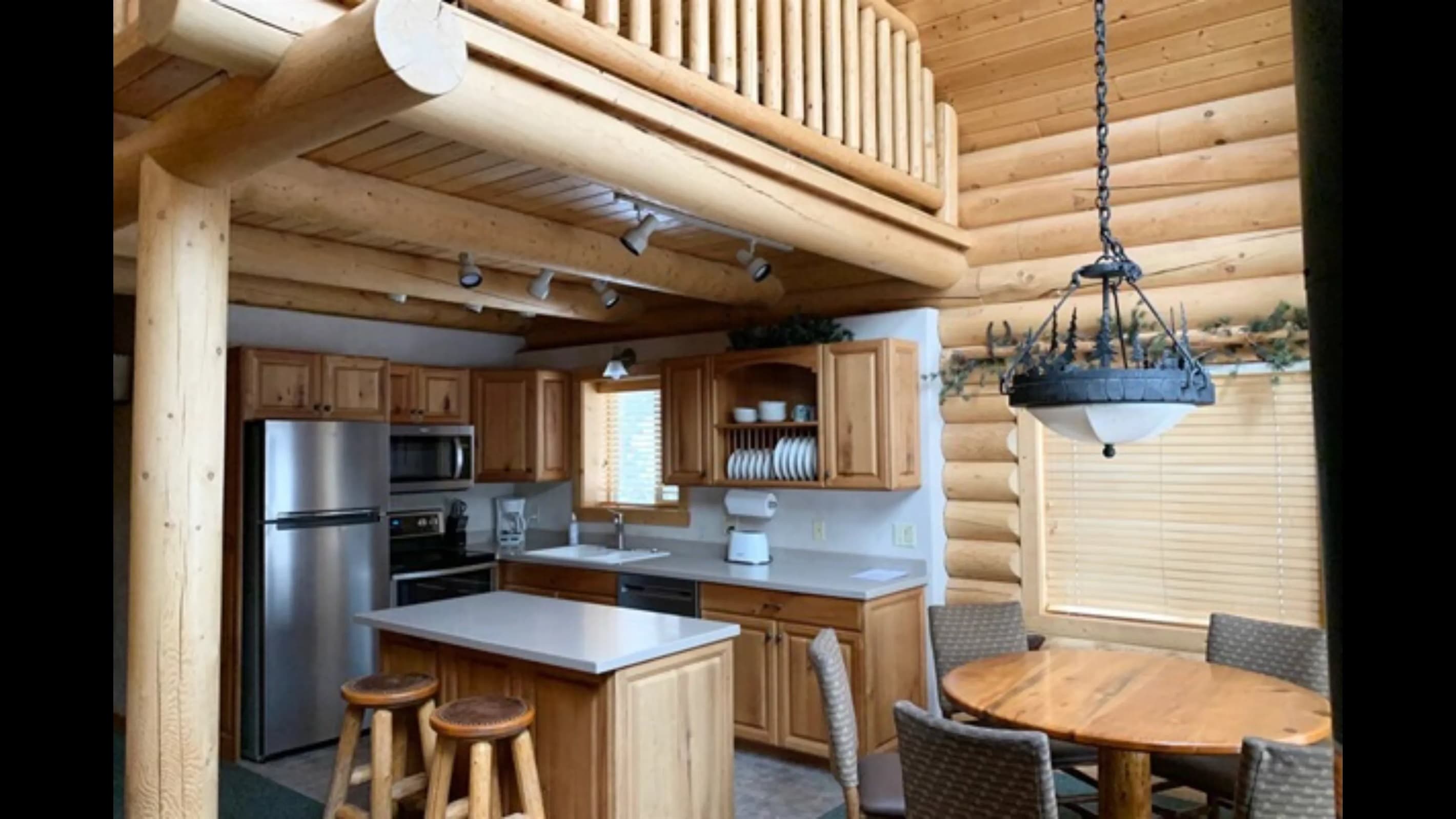 Fully equipped kitchen with essentials, including a refrigerator, stove, oven, microwave, and dishwasher.