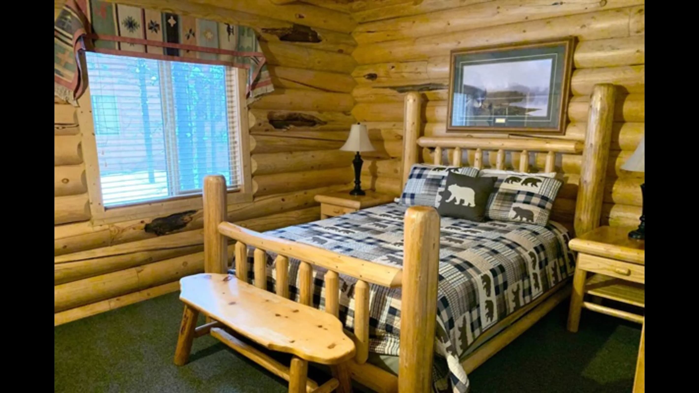 Bedroom 2 features a comfortable queen bed and a bright window.