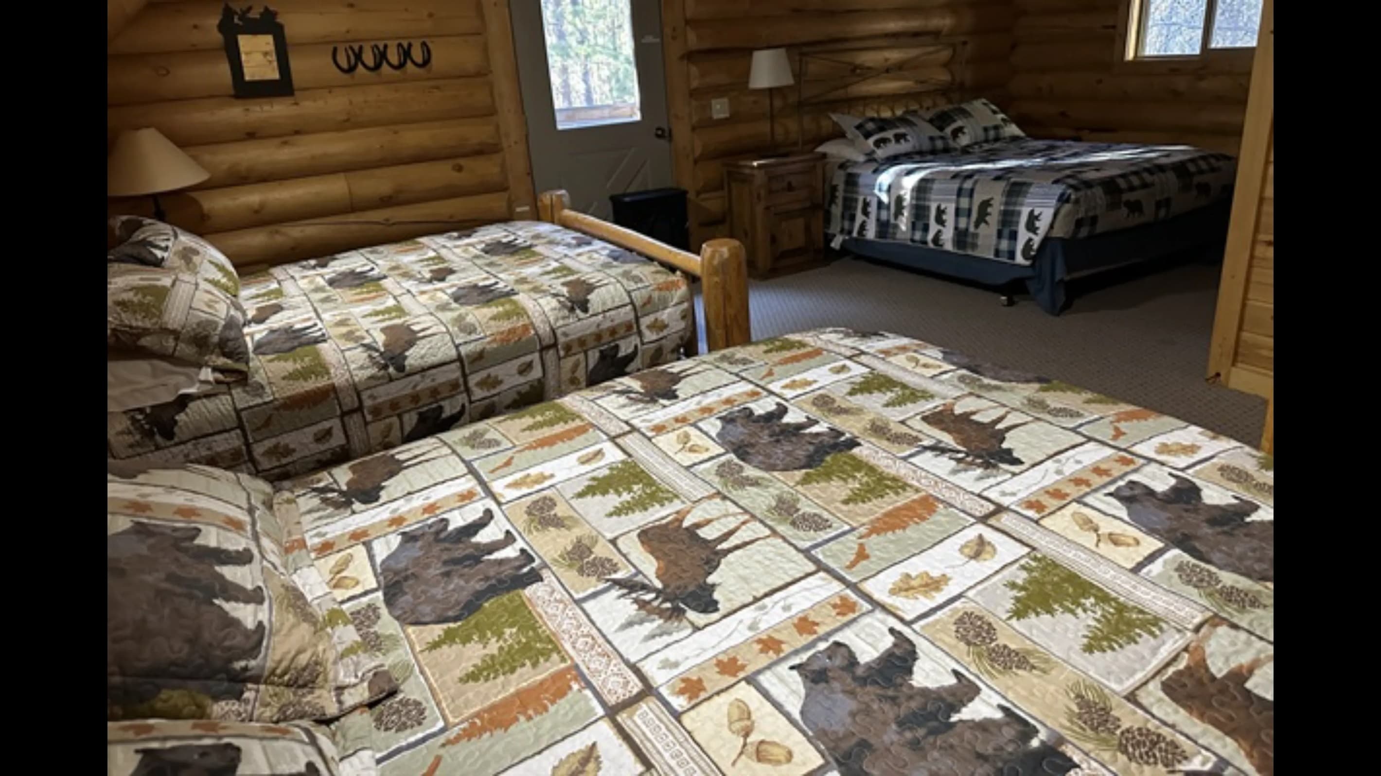The upstairs room has three queen beds