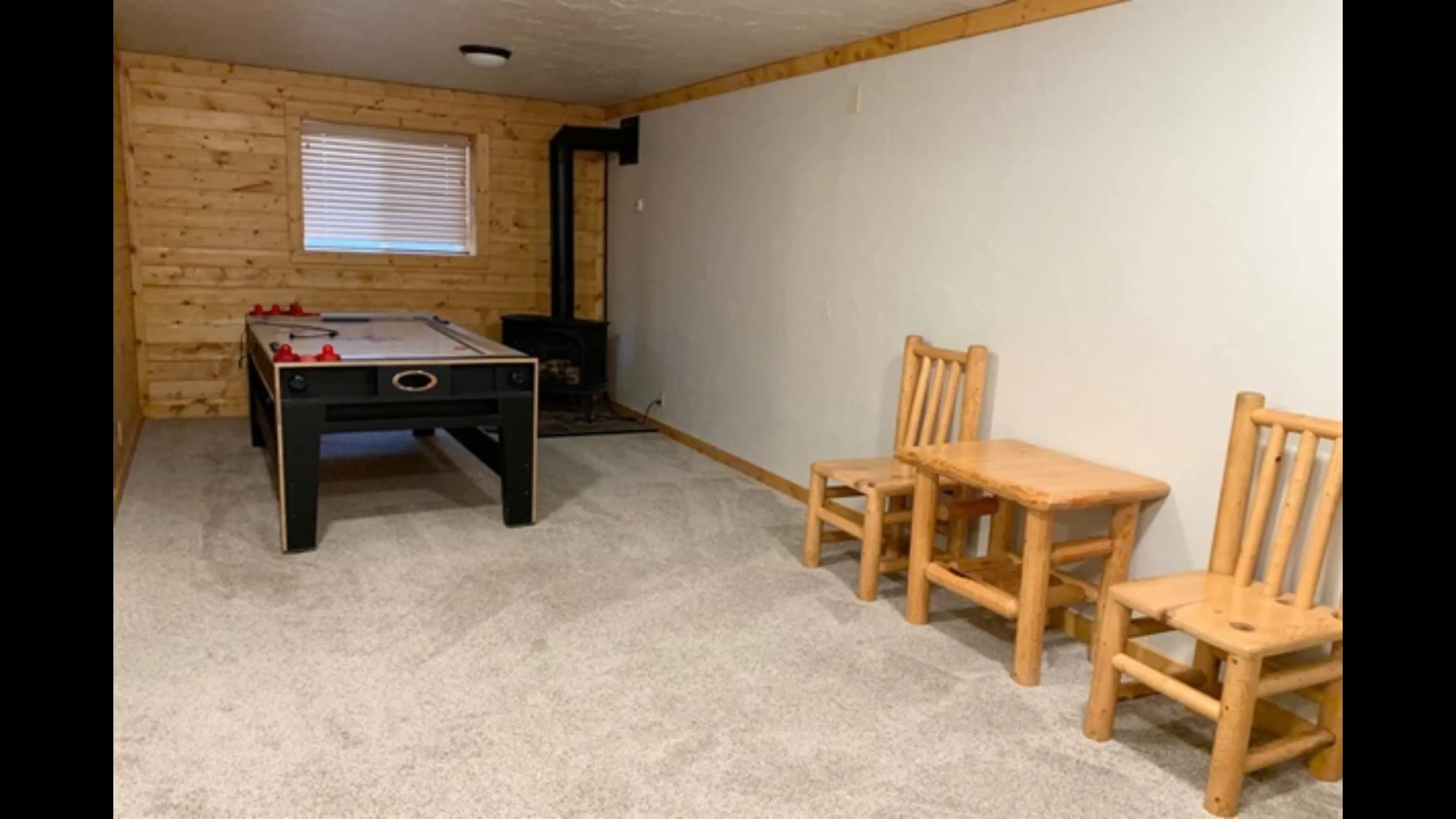 Game room which includes air hockey